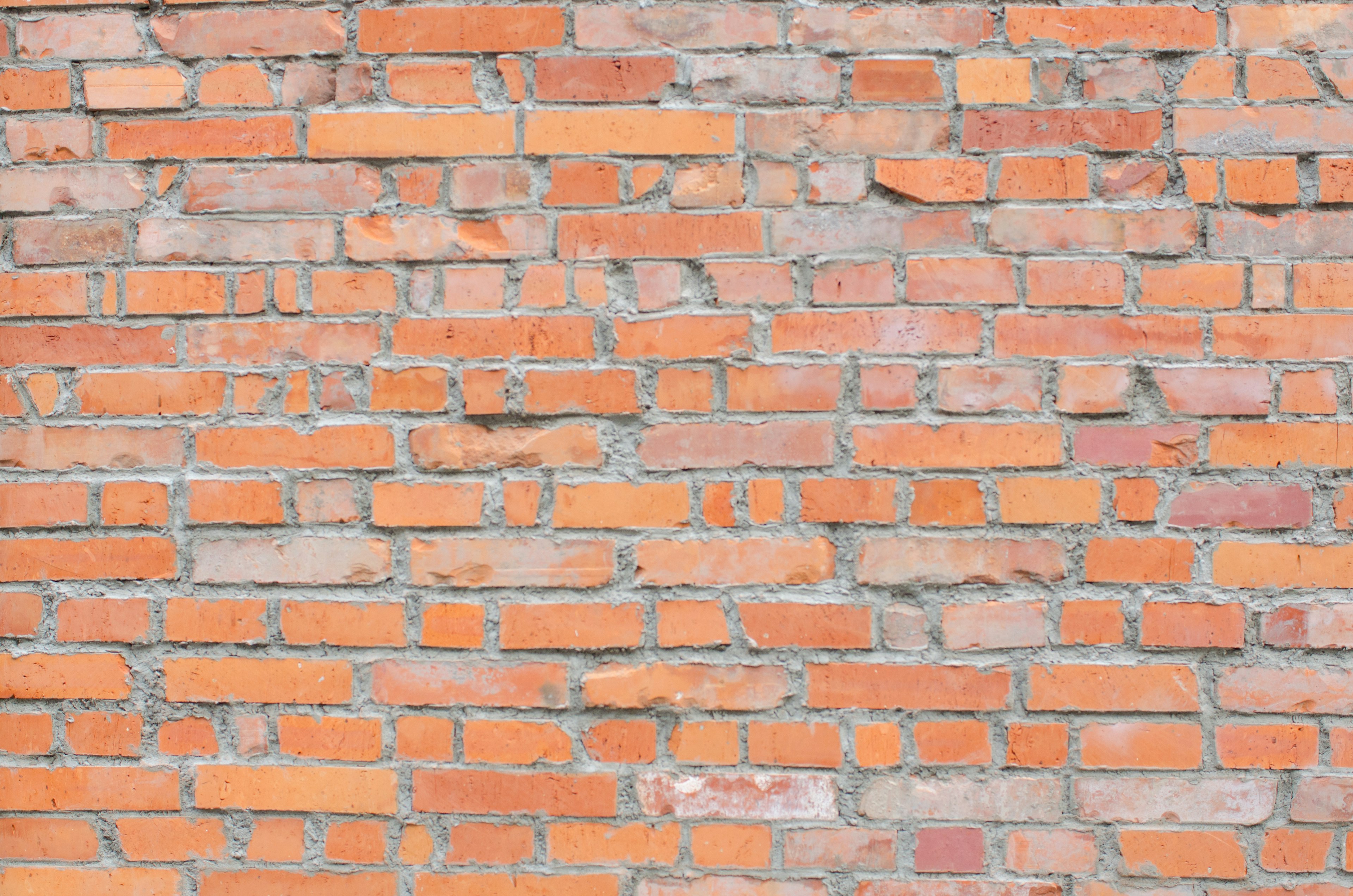 Textura de una pared de ladrillos rojo-naranja