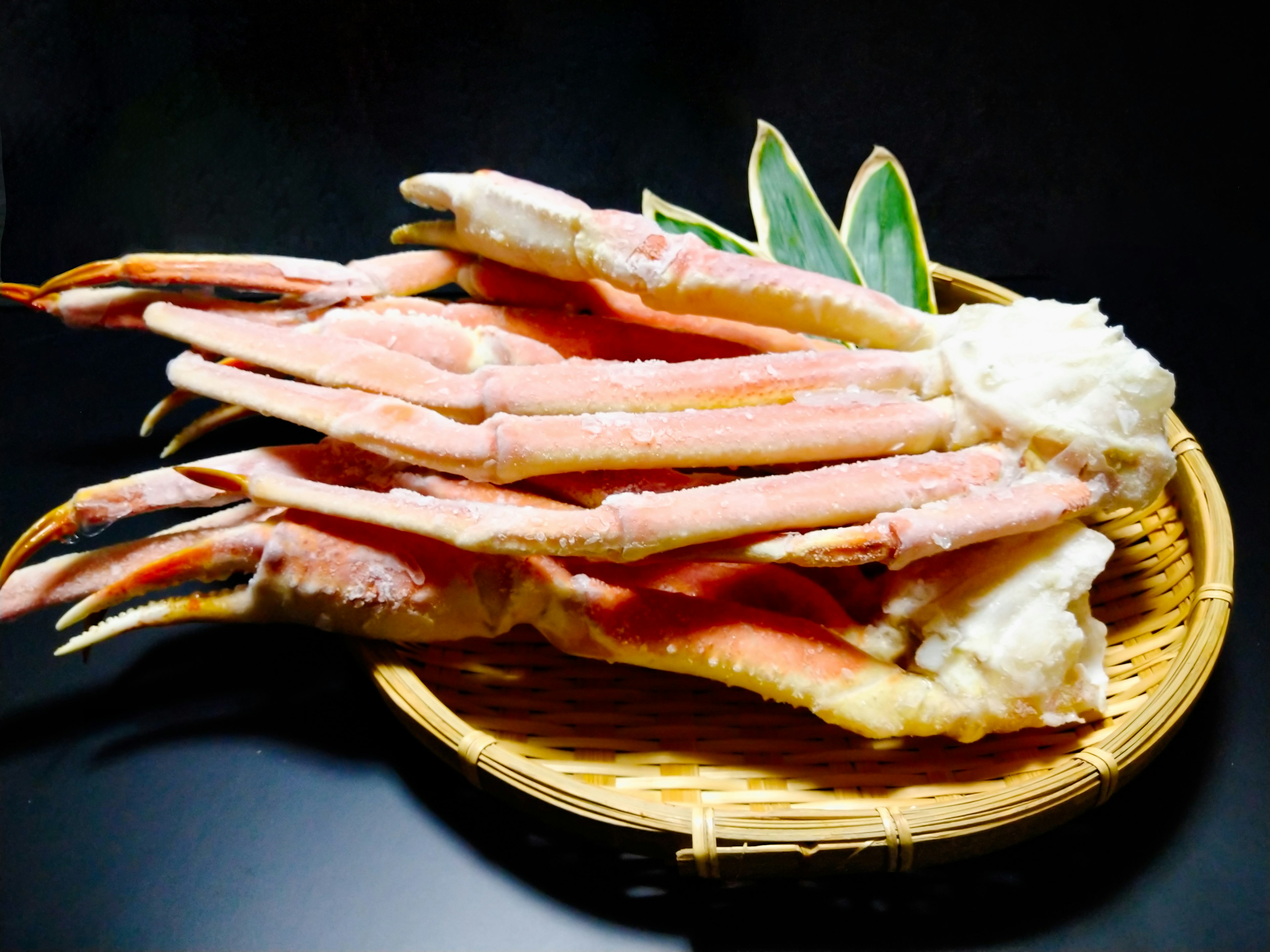 Image of crab legs arranged in a basket