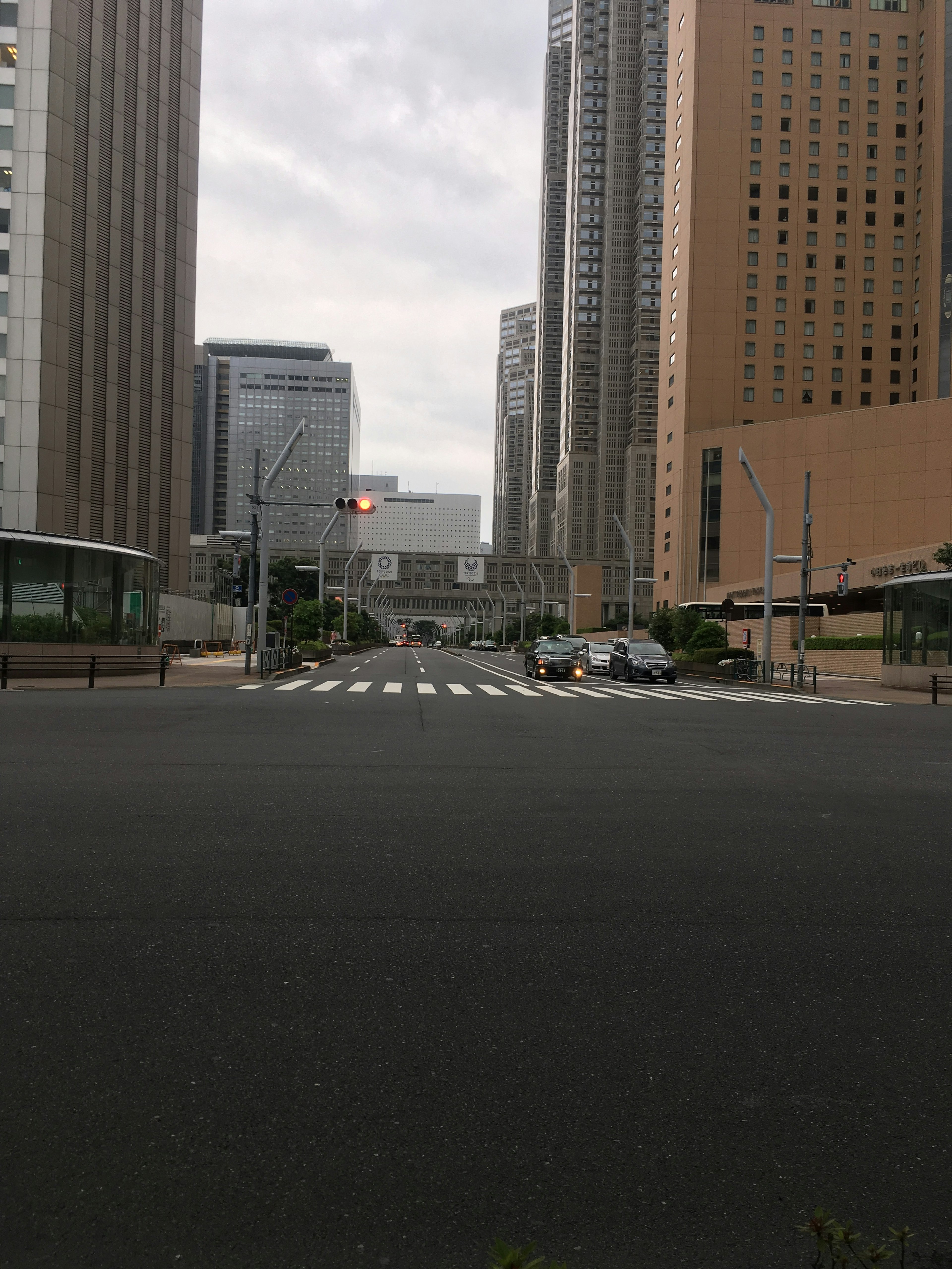 City intersection with tall buildings and crosswalk