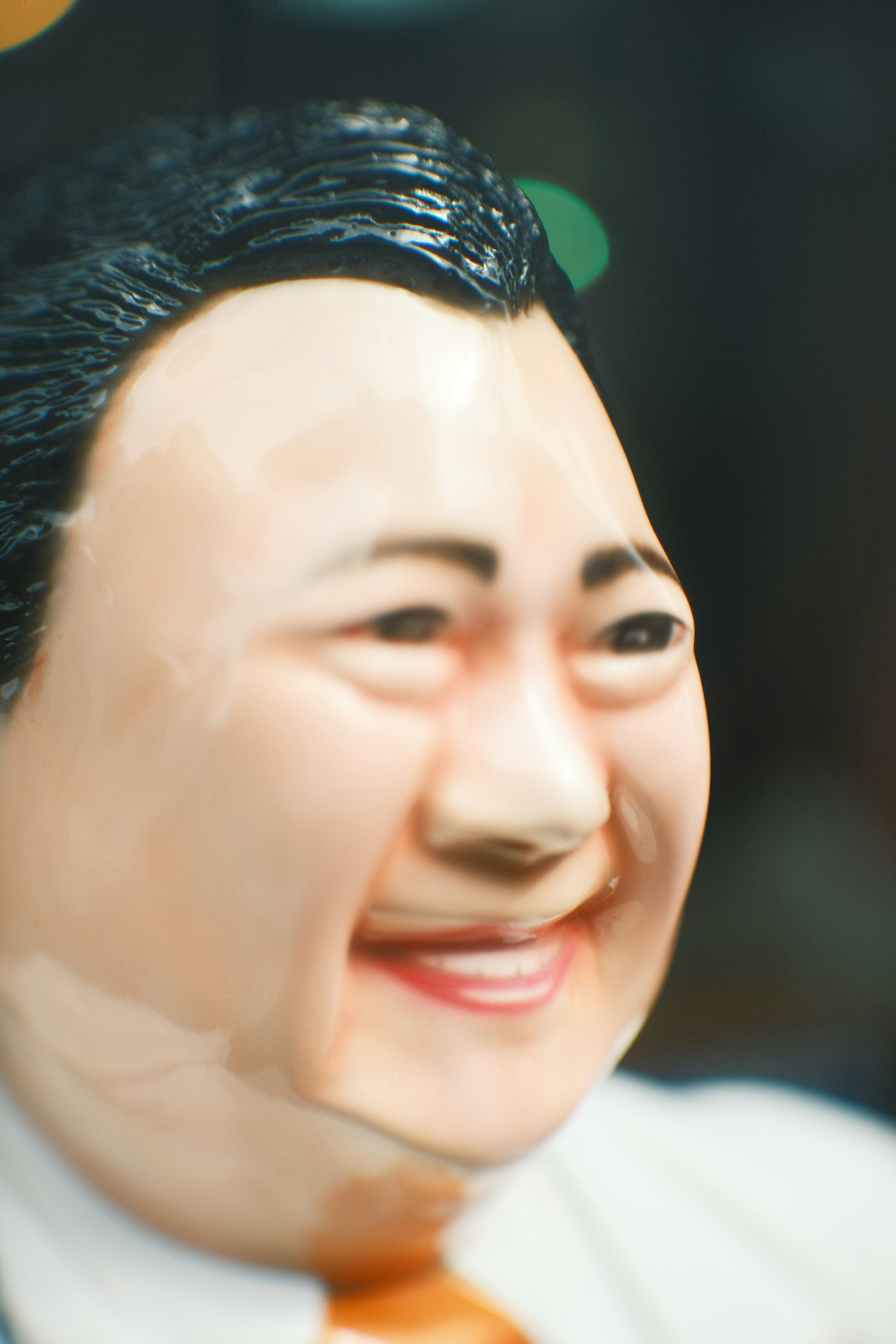 Close-up of a smiling doll's face