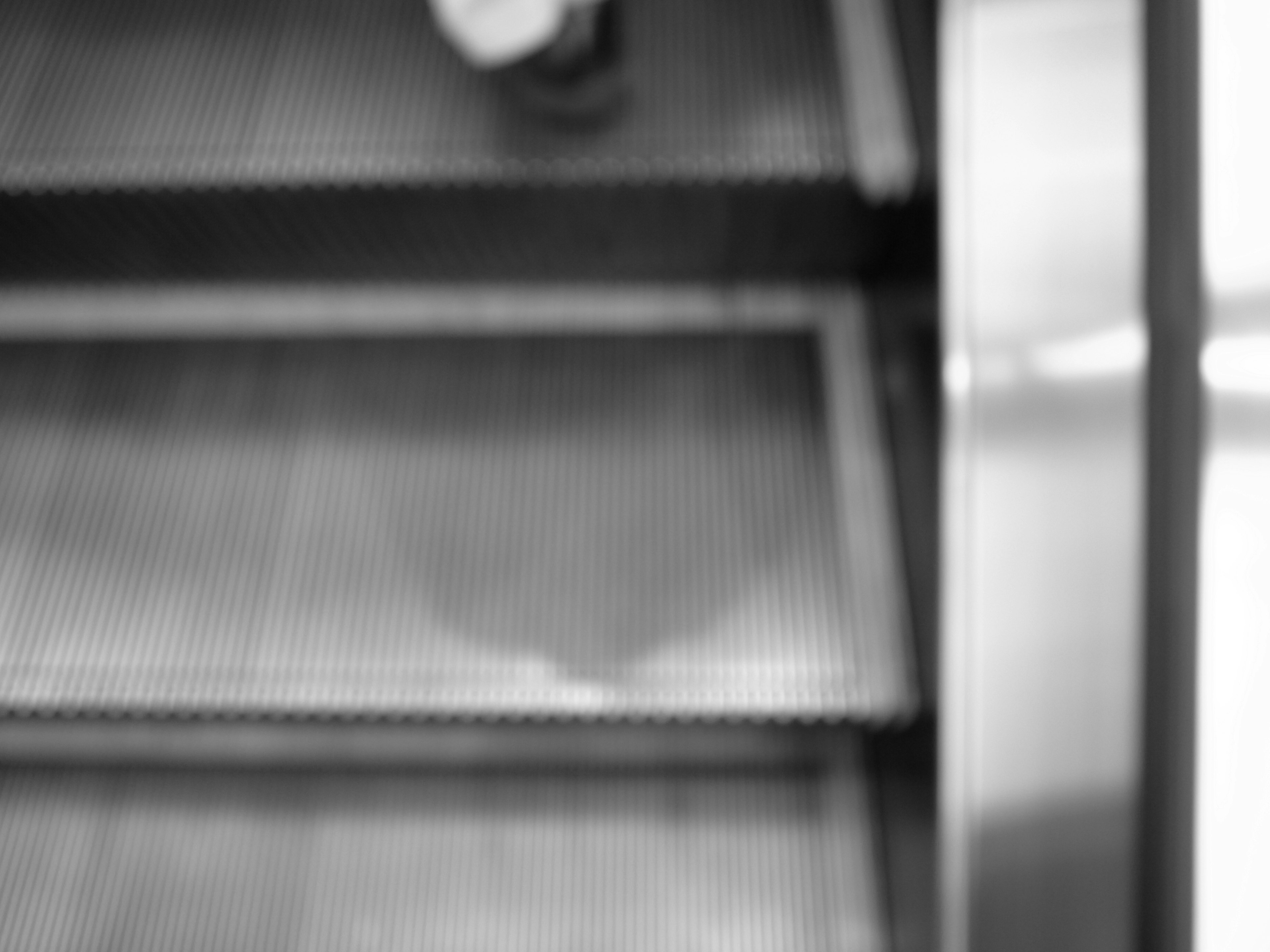 Blurred image of a foot on stairs