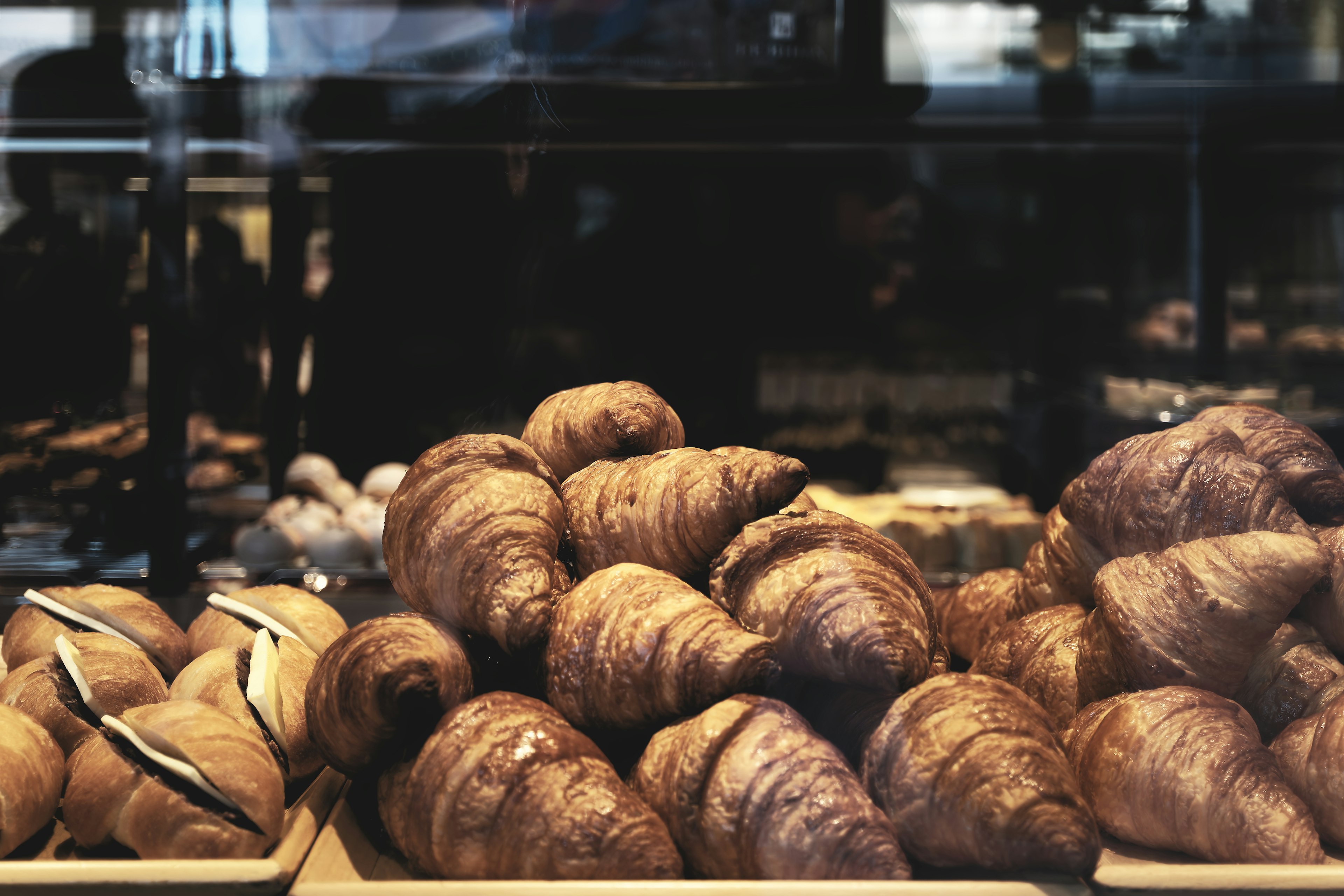 Delicious croissants displayed in a bakery case