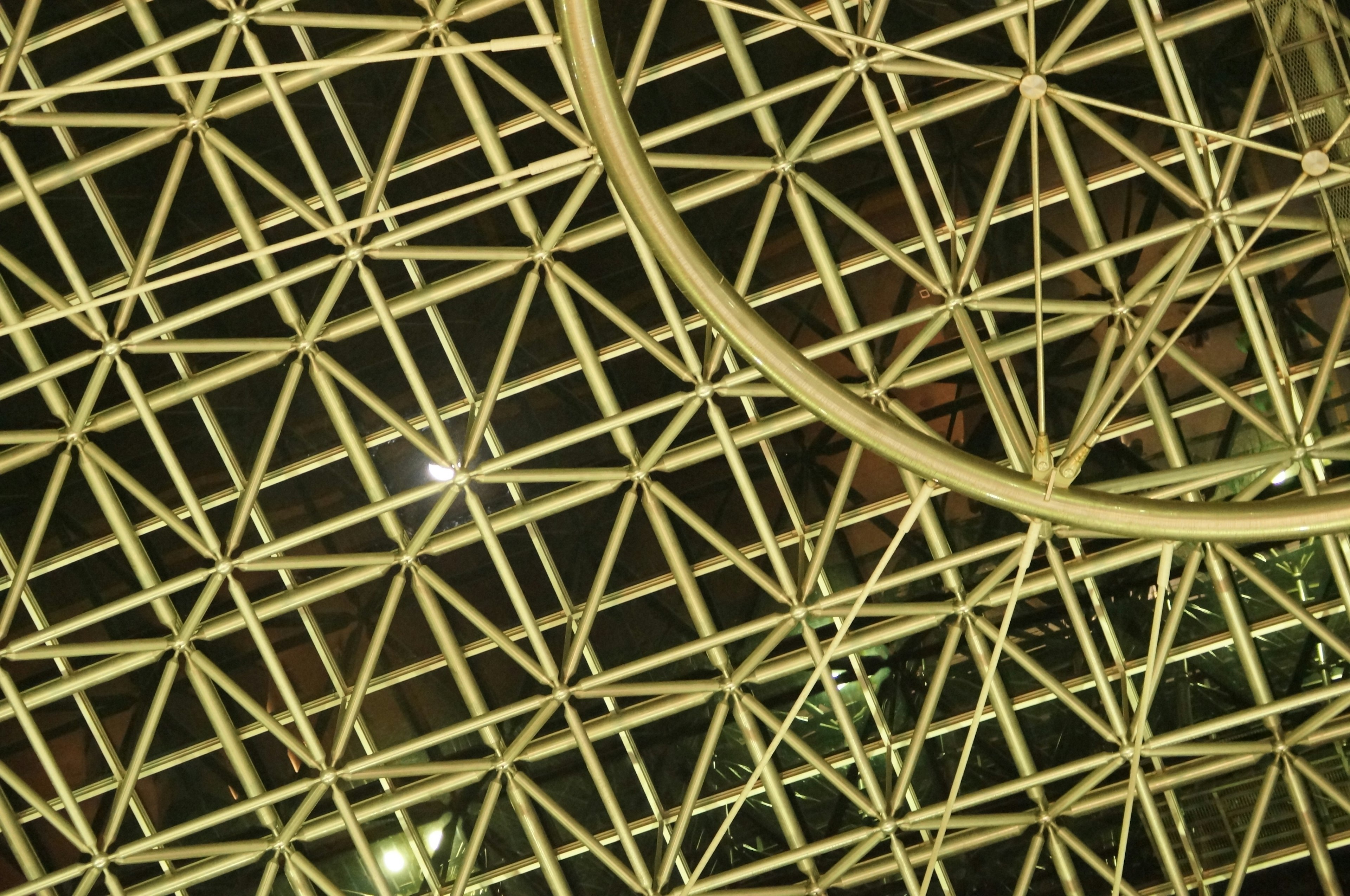 Metal lattice ceiling structure with circular design features