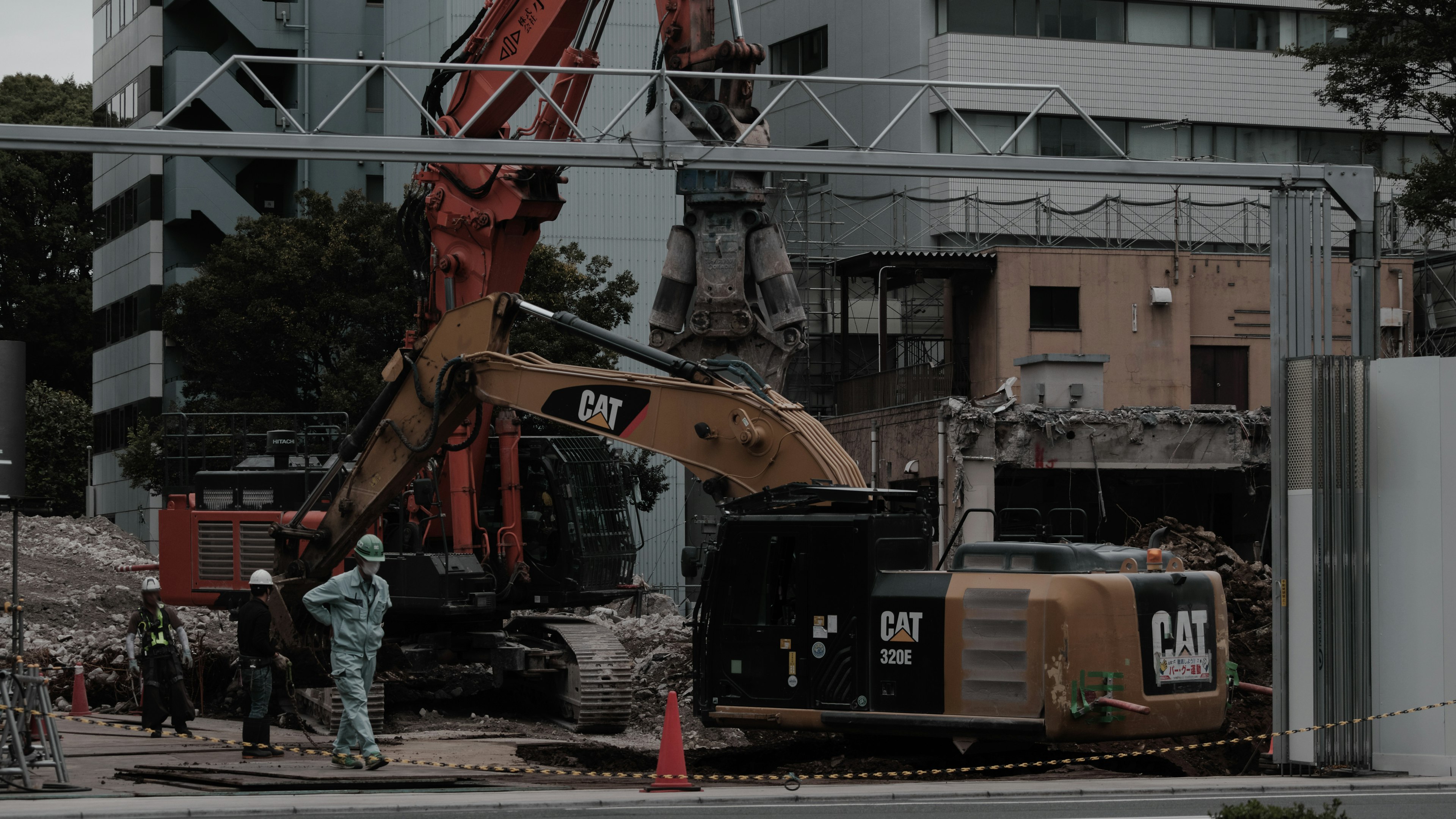 Construction site featuring heavy machinery and workers in action