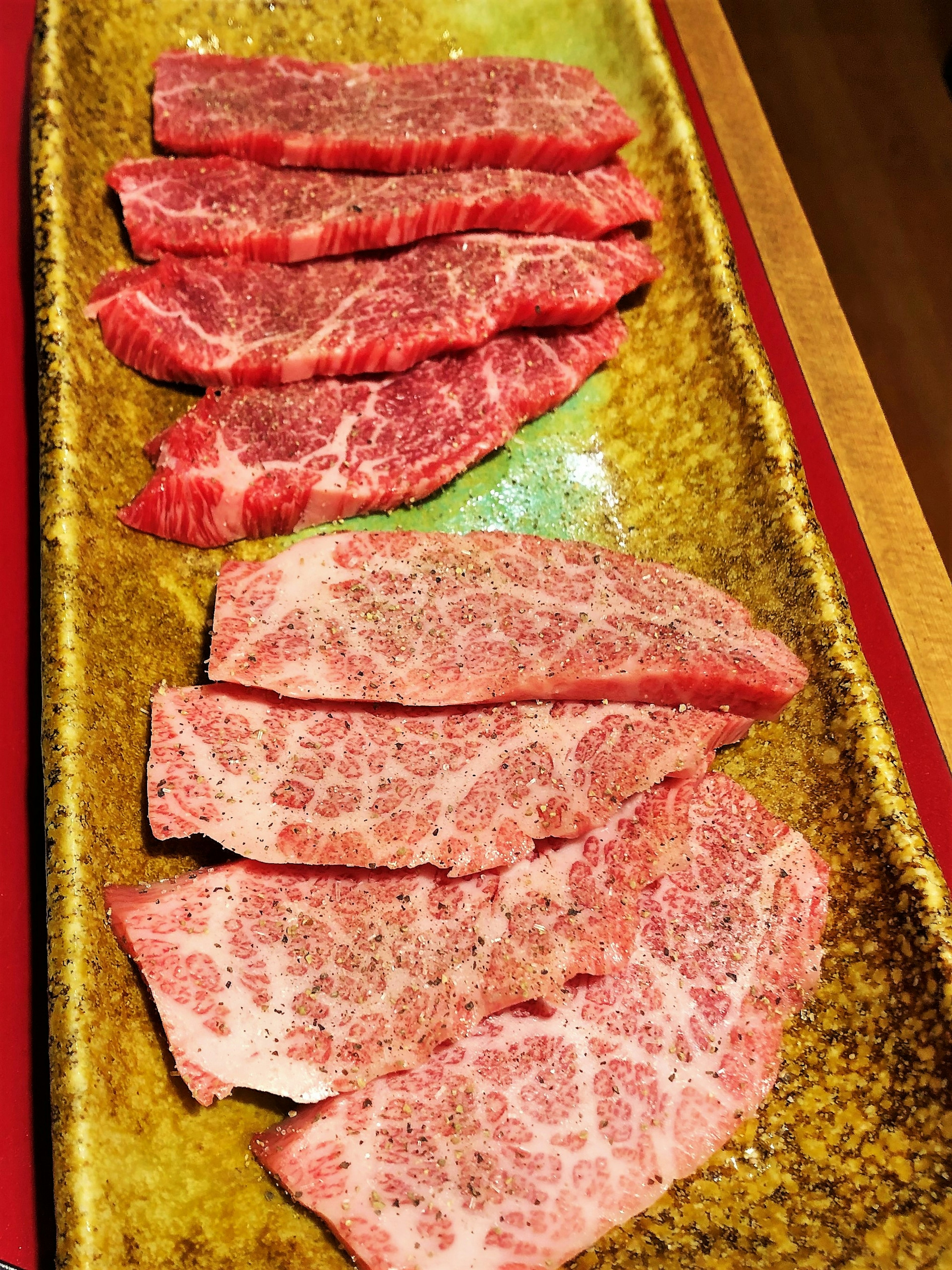 Beautifully arranged slices of Wagyu beef on a plate