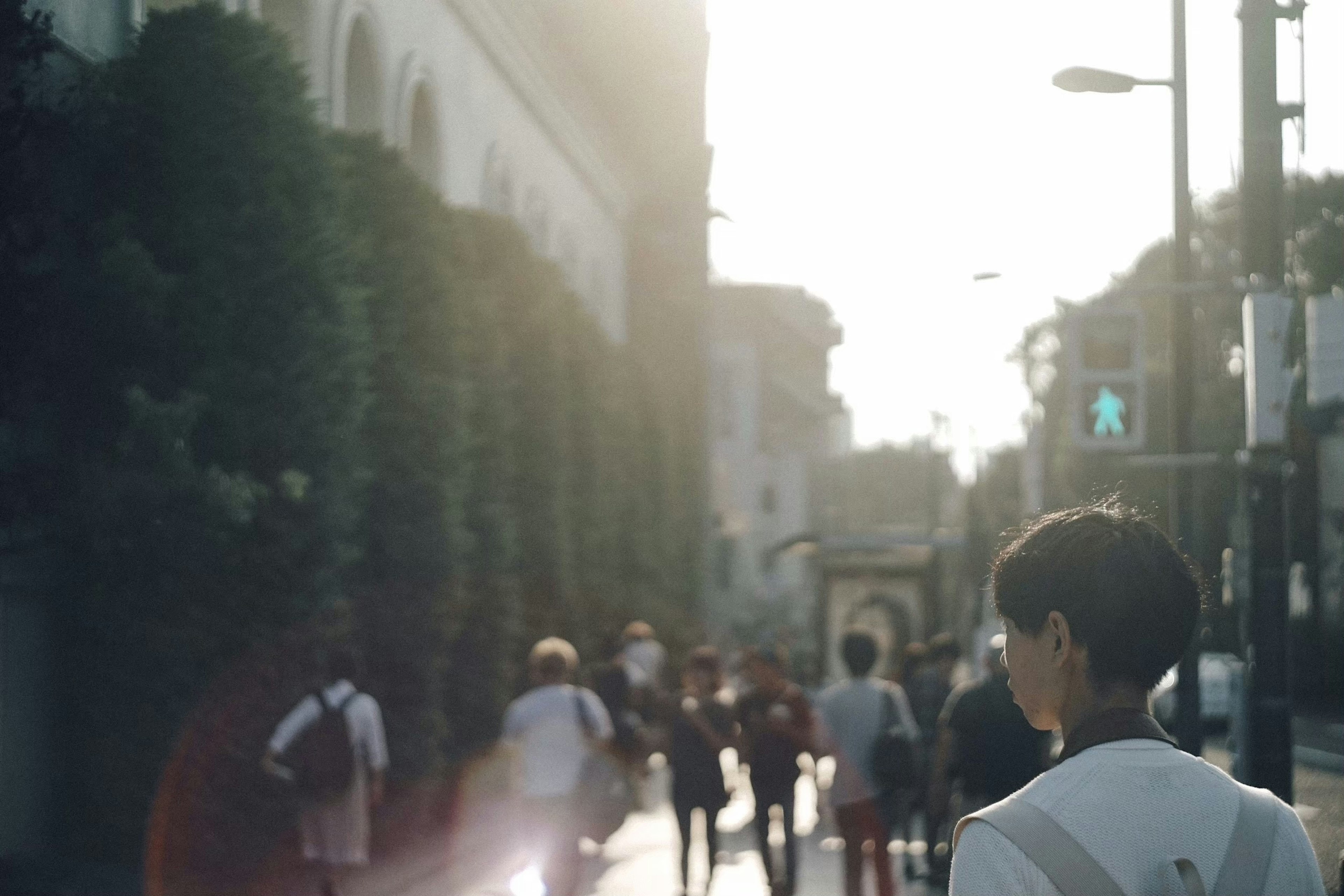 People walking in the city during sunset with warm lighting