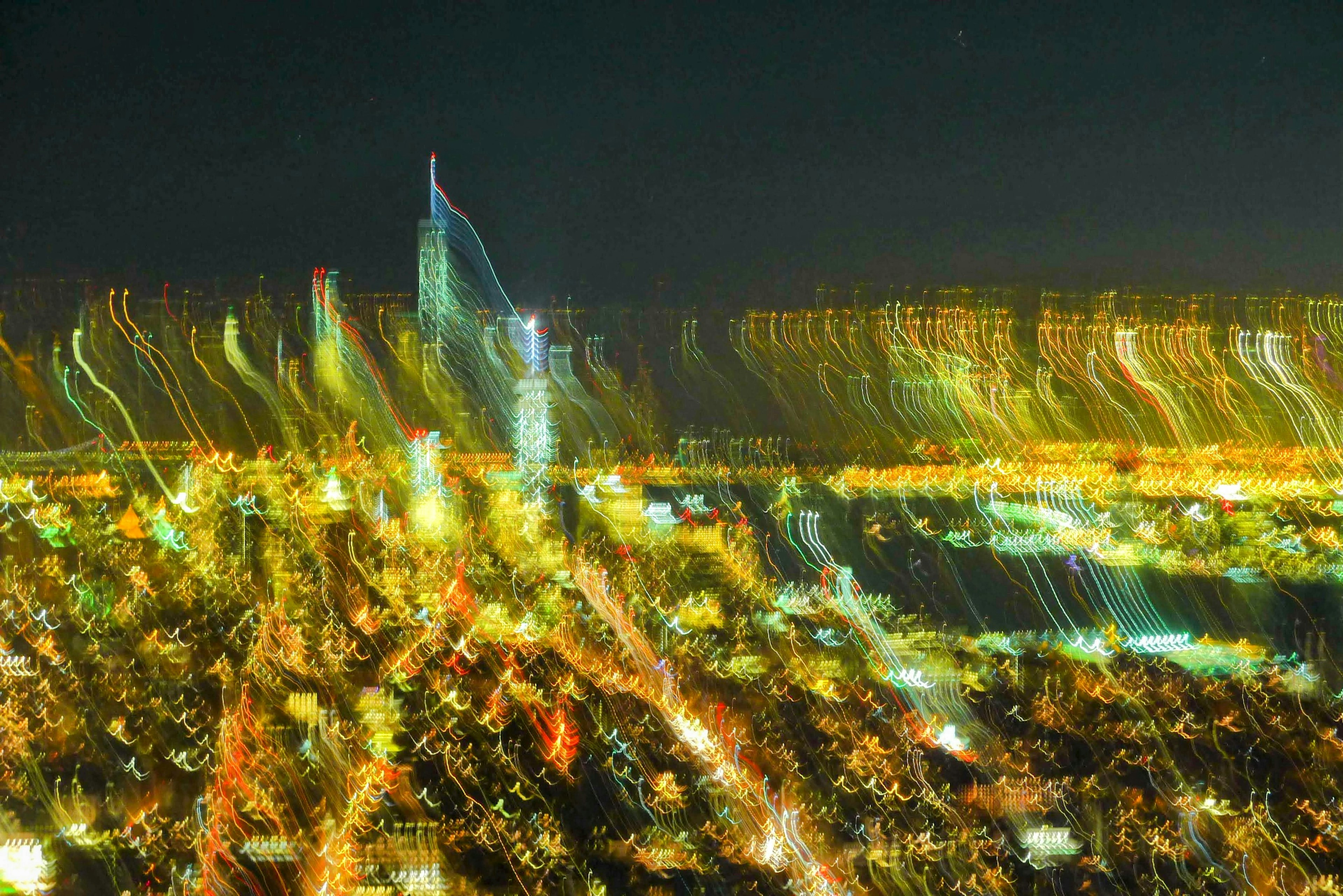 Vibrant city lights captured in a blurred motion effect at night