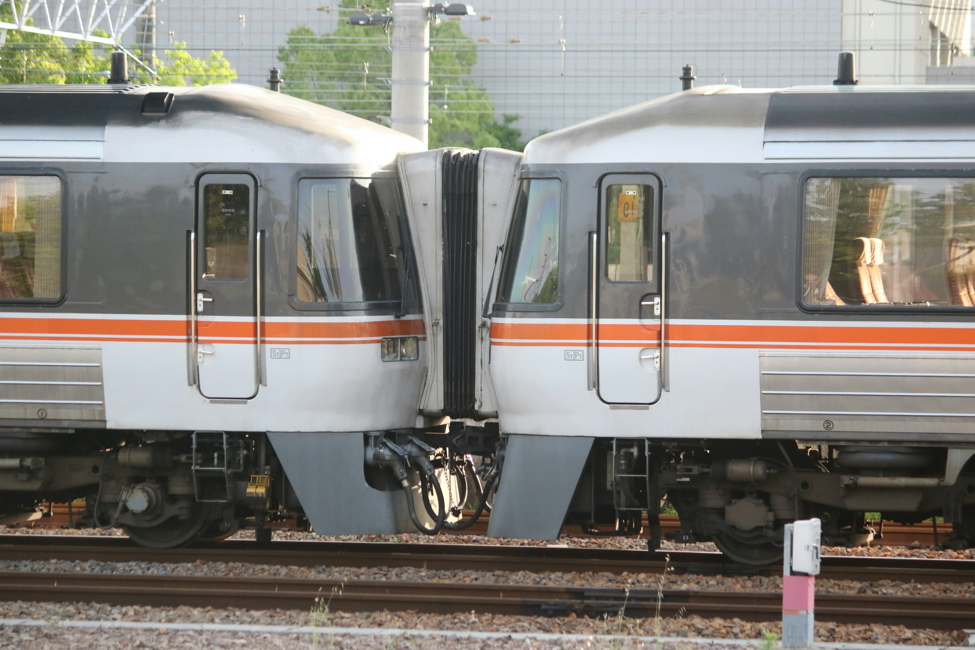 Two trains connecting on railway tracks