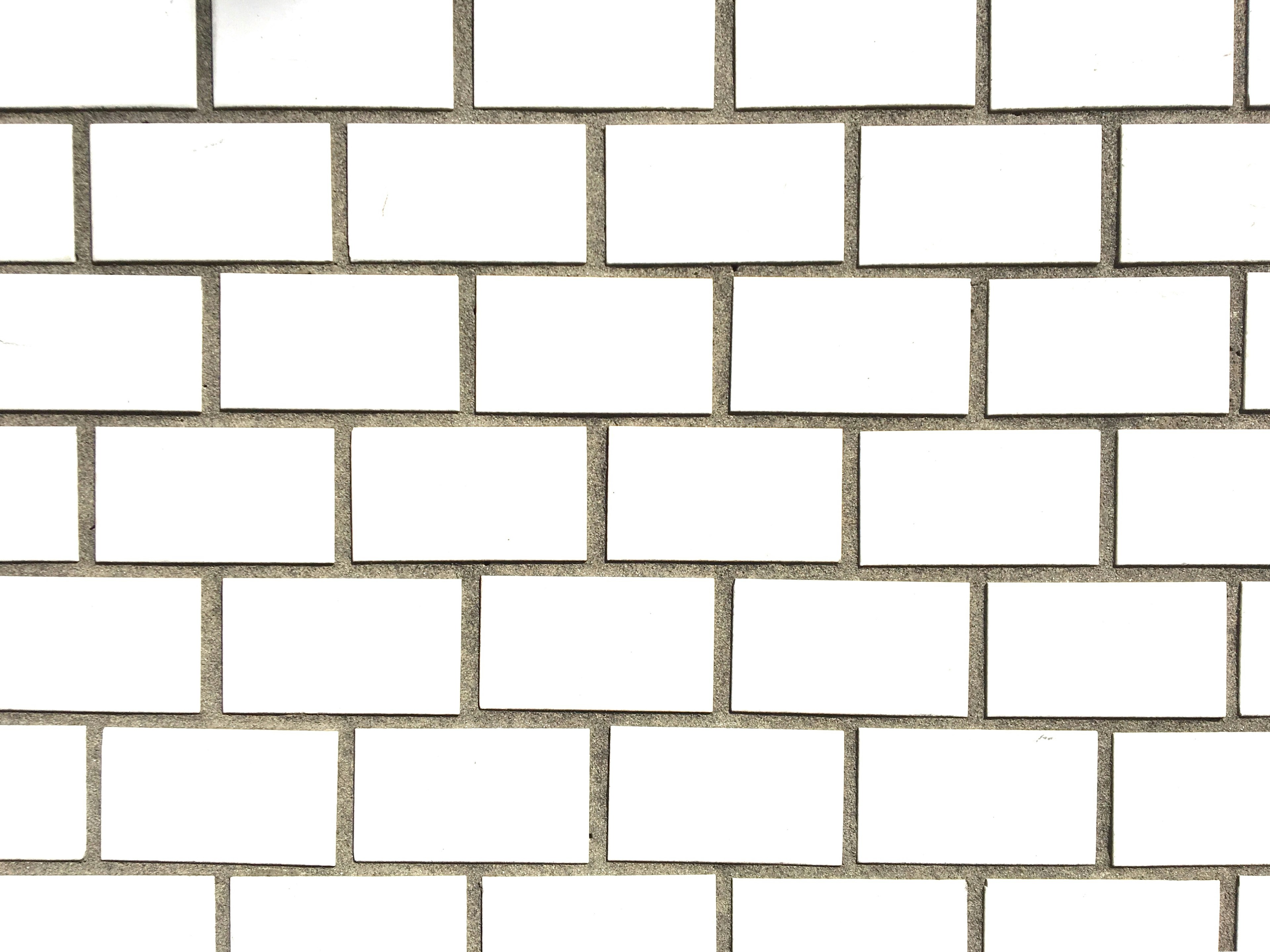 Pattern of white tiled wall with rectangular tiles