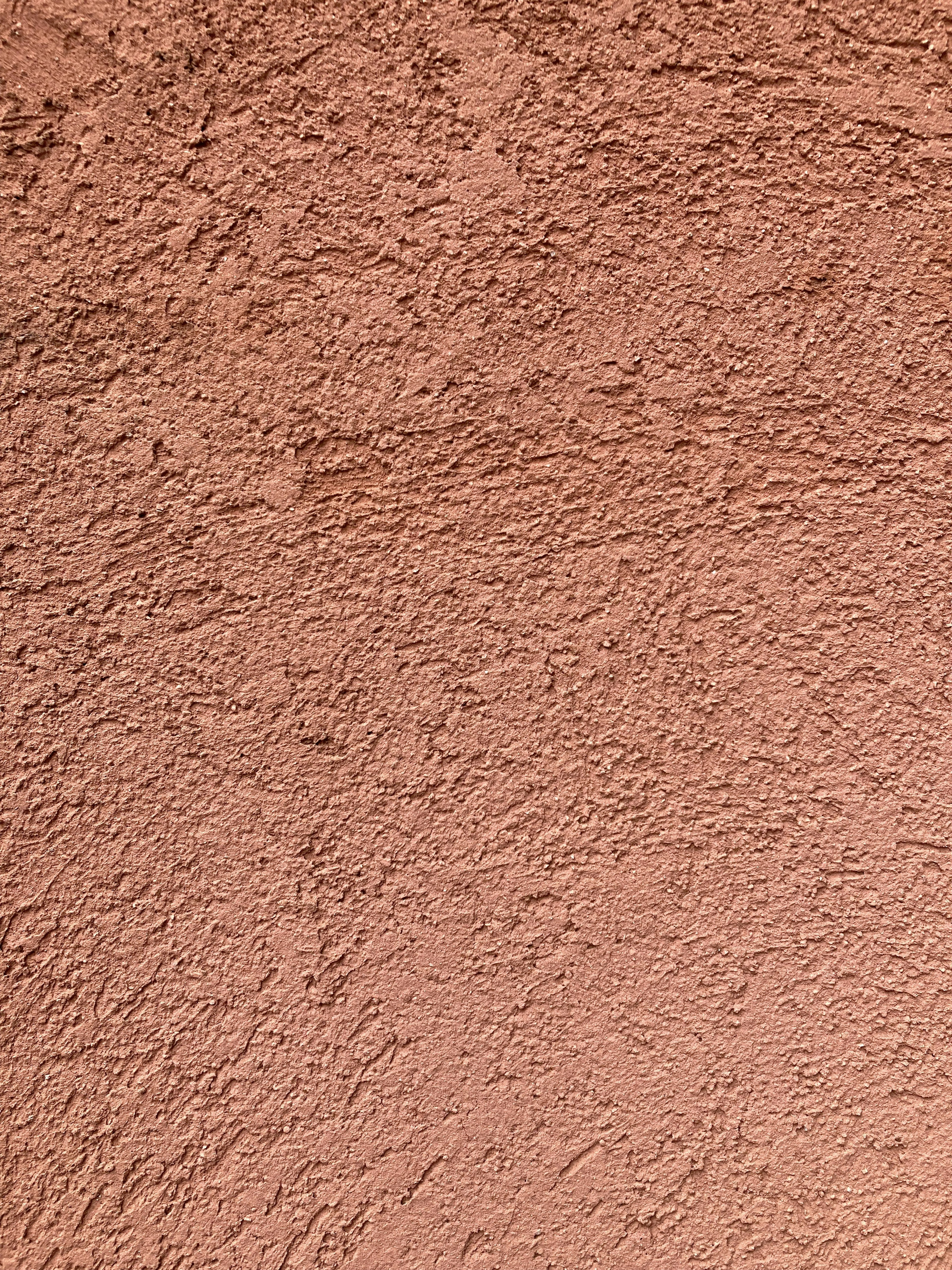 Close-up of a textured pink wall surface