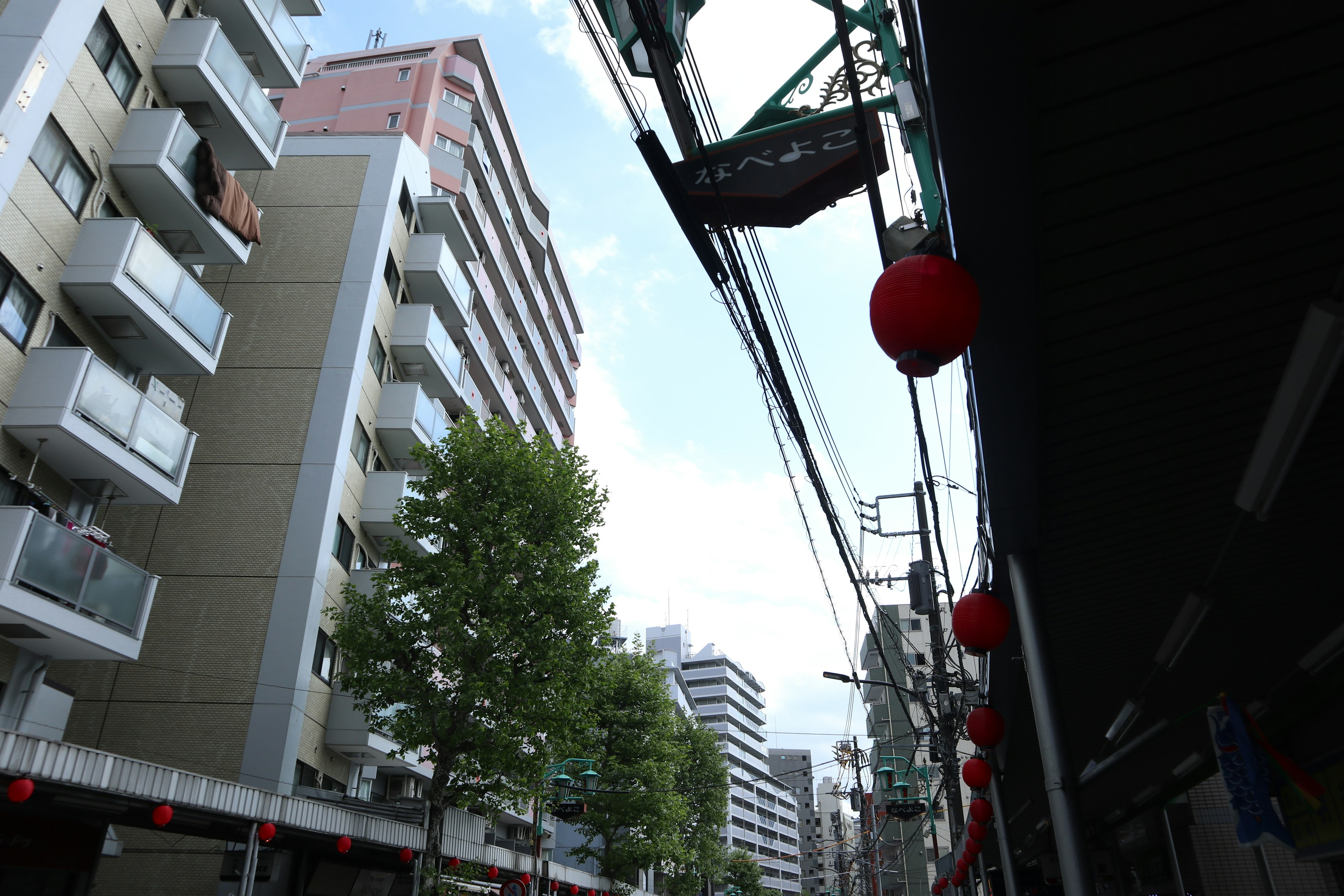 Urban scene in Tokyo featuring buildings and red lanterns