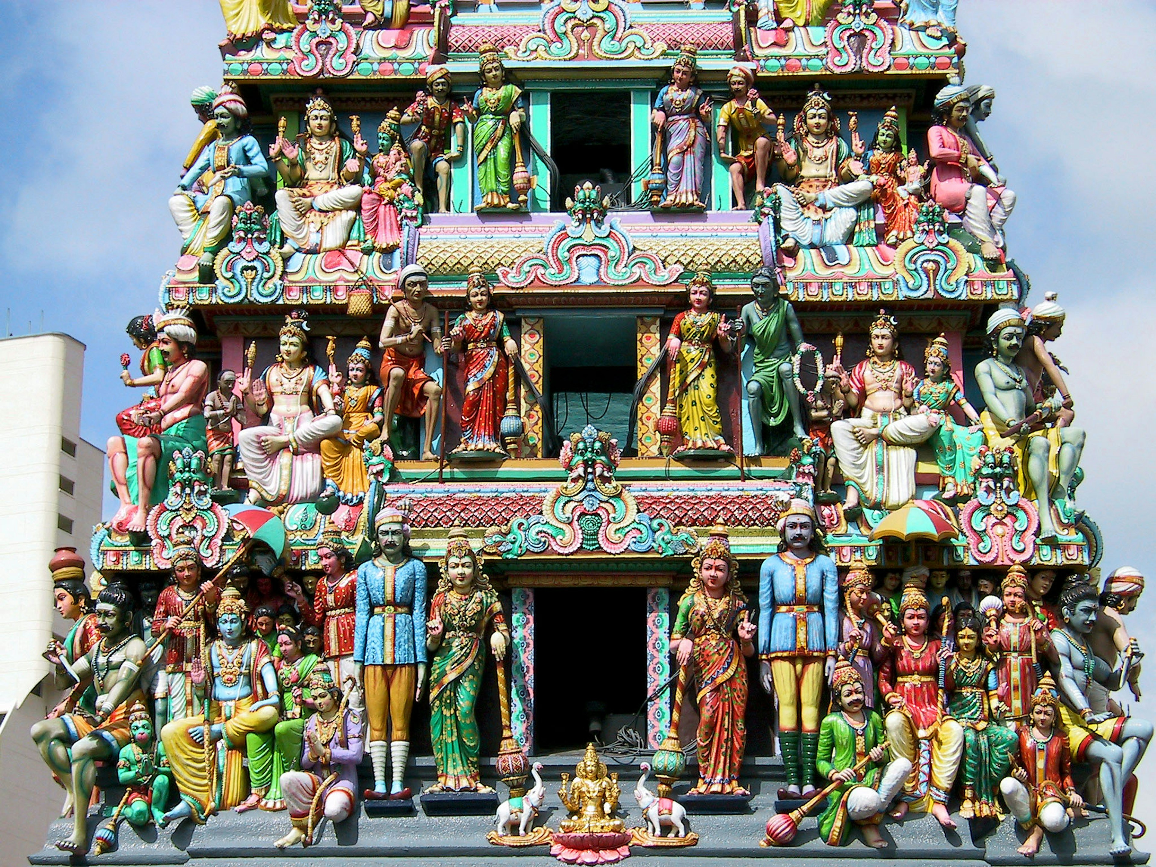 Temple tower adorned with colorful statues of deities