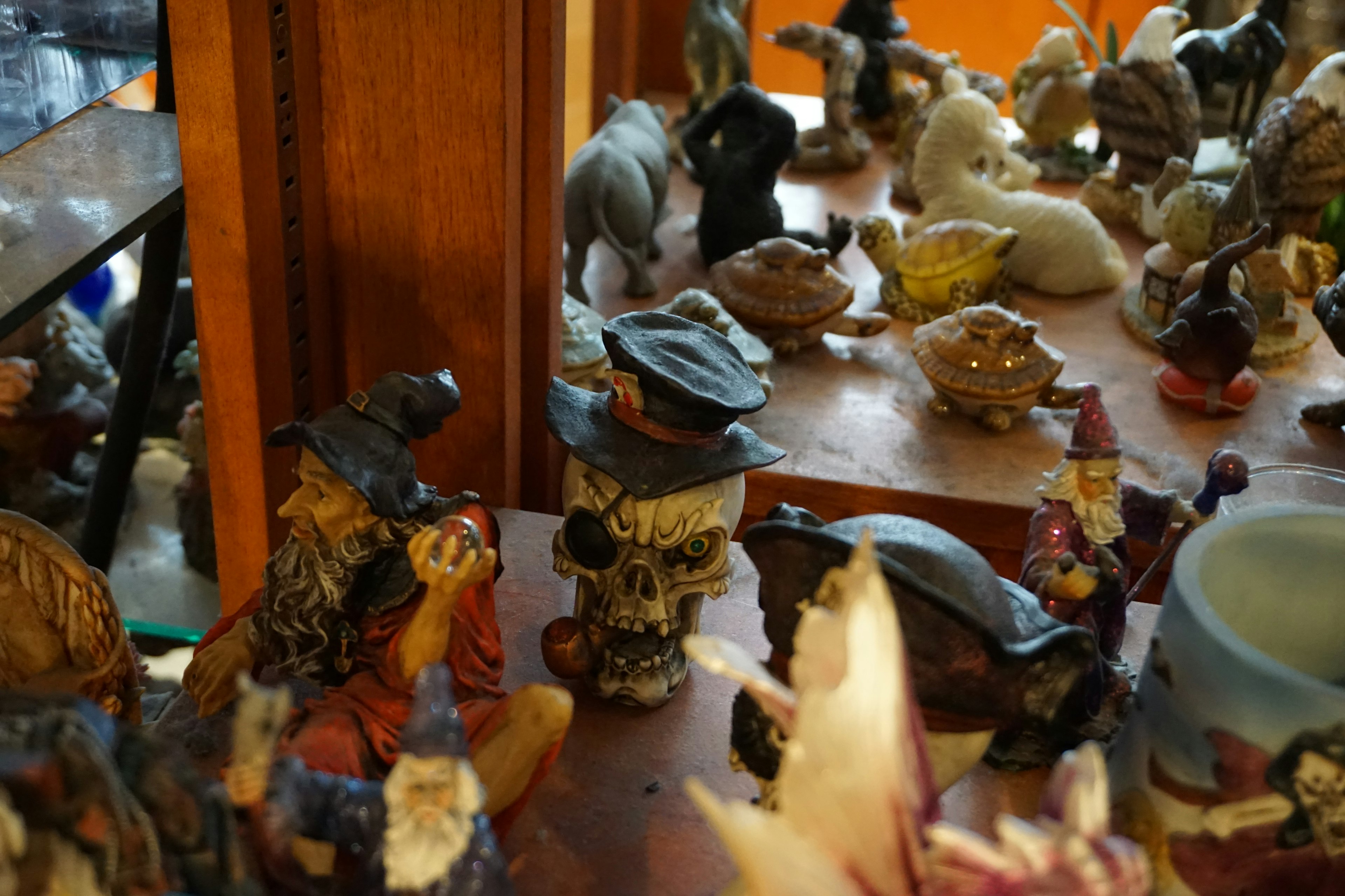 Close-up view of a shelf filled with various small figurines