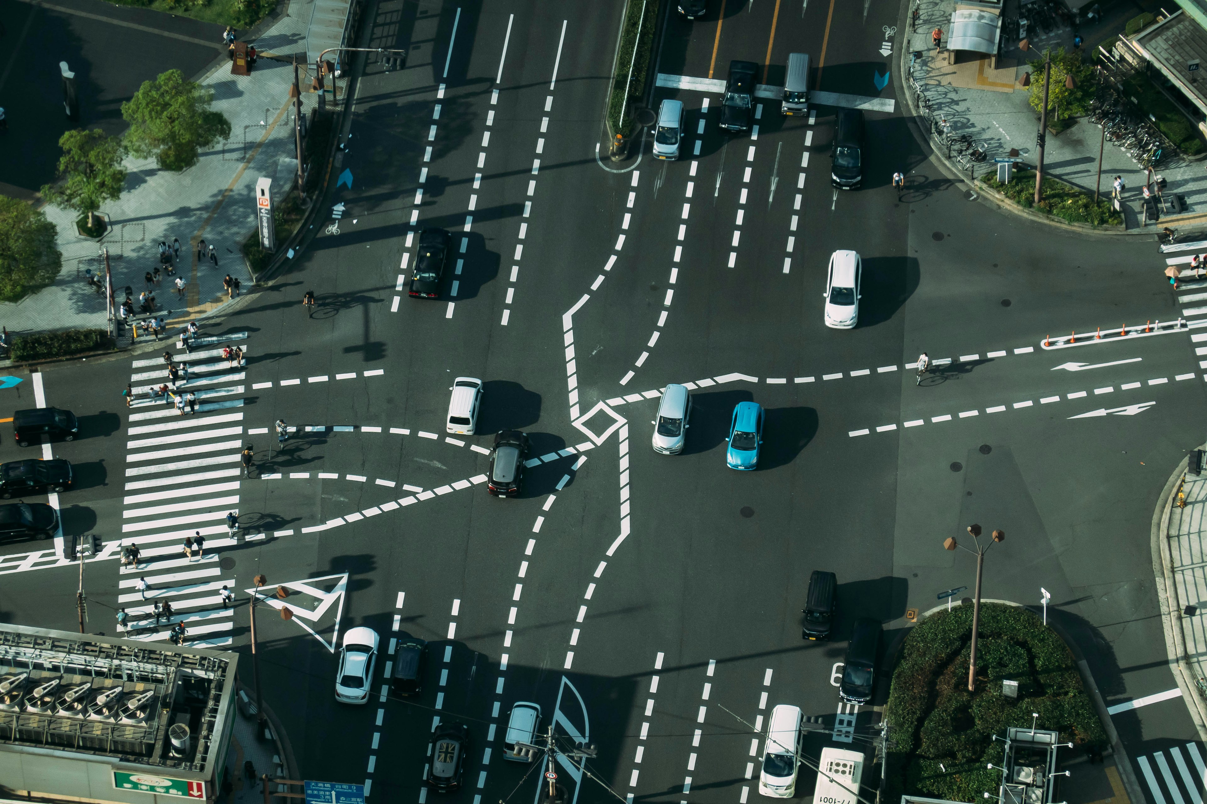 Aerial view of an intersection with vehicles navigating through it