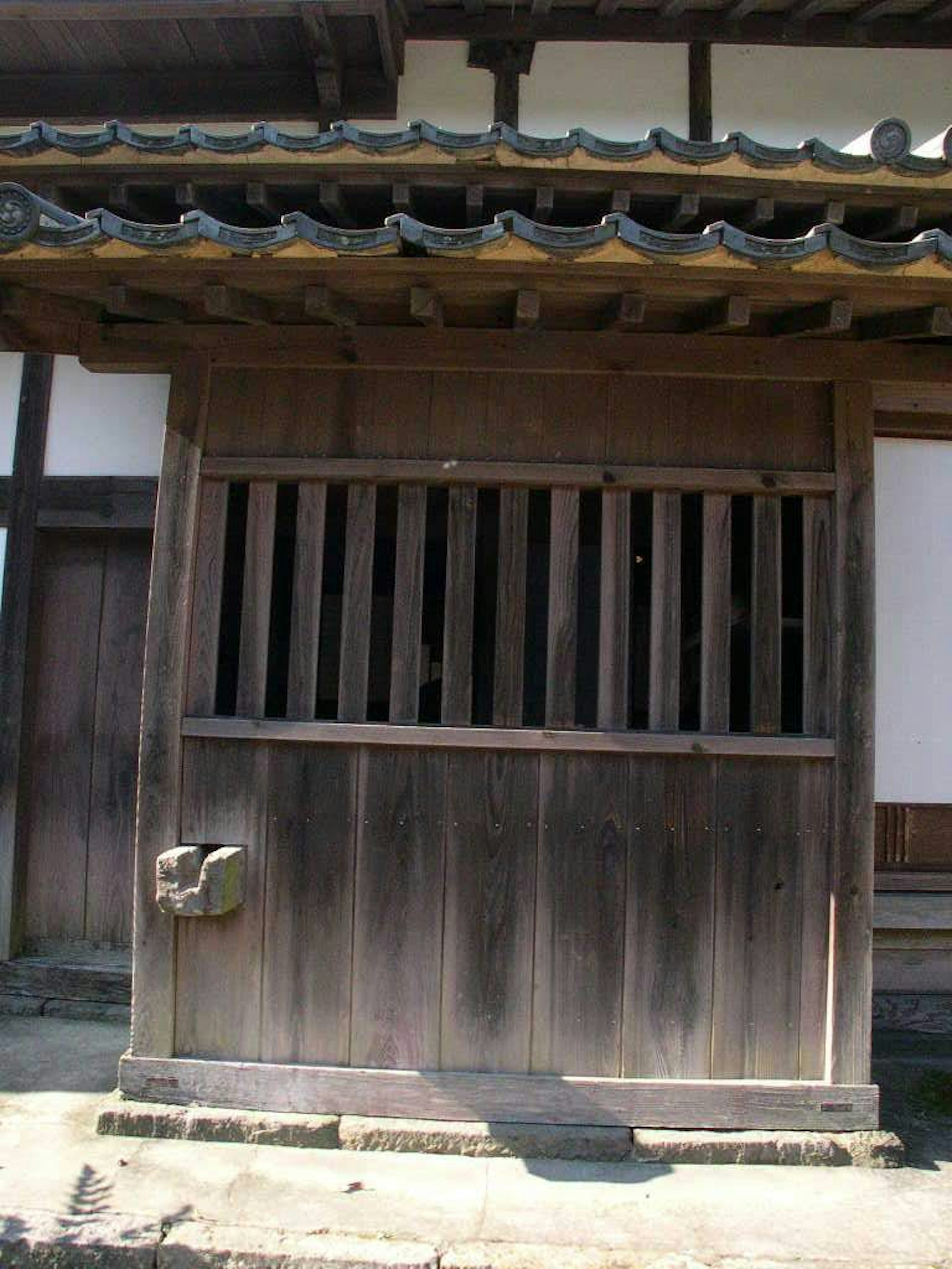 Traditional Japanese wooden door with roof details