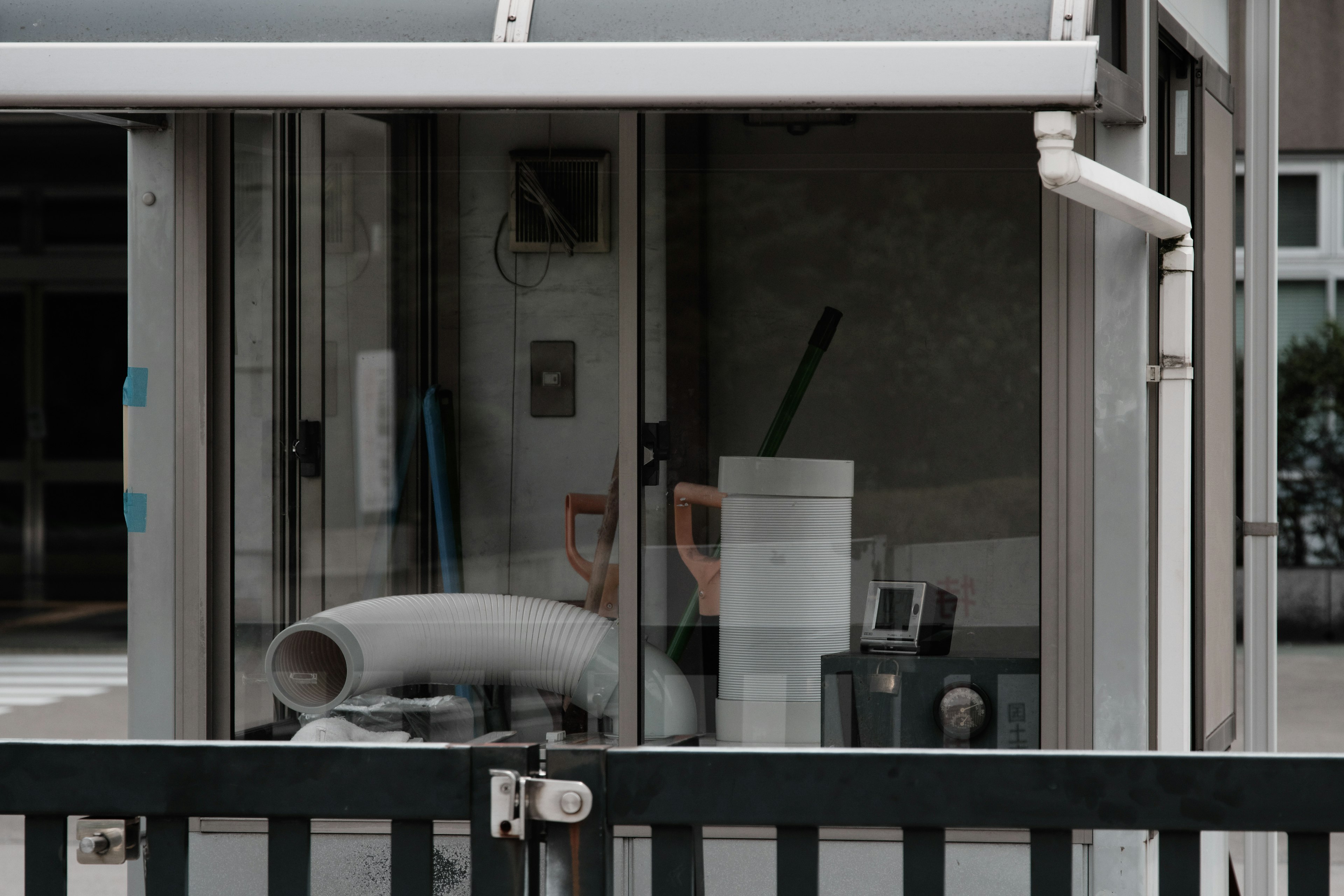 Interior of a glass booth with tools and materials