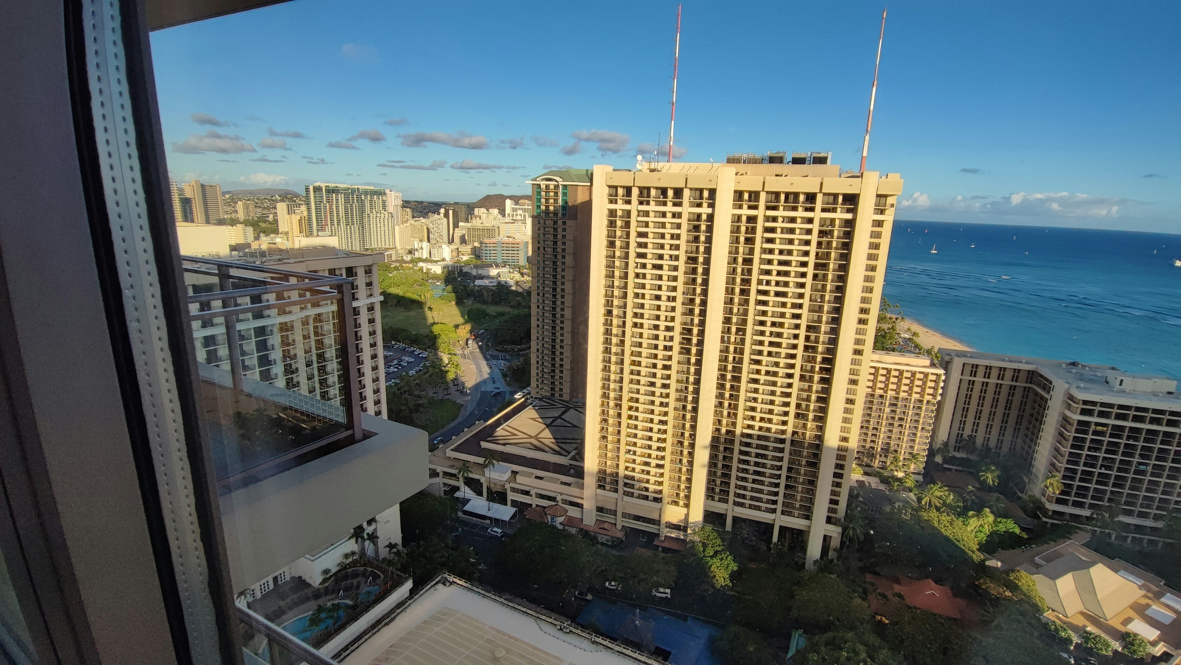 View of Honolulu from a high-rise building featuring blue sky and ocean