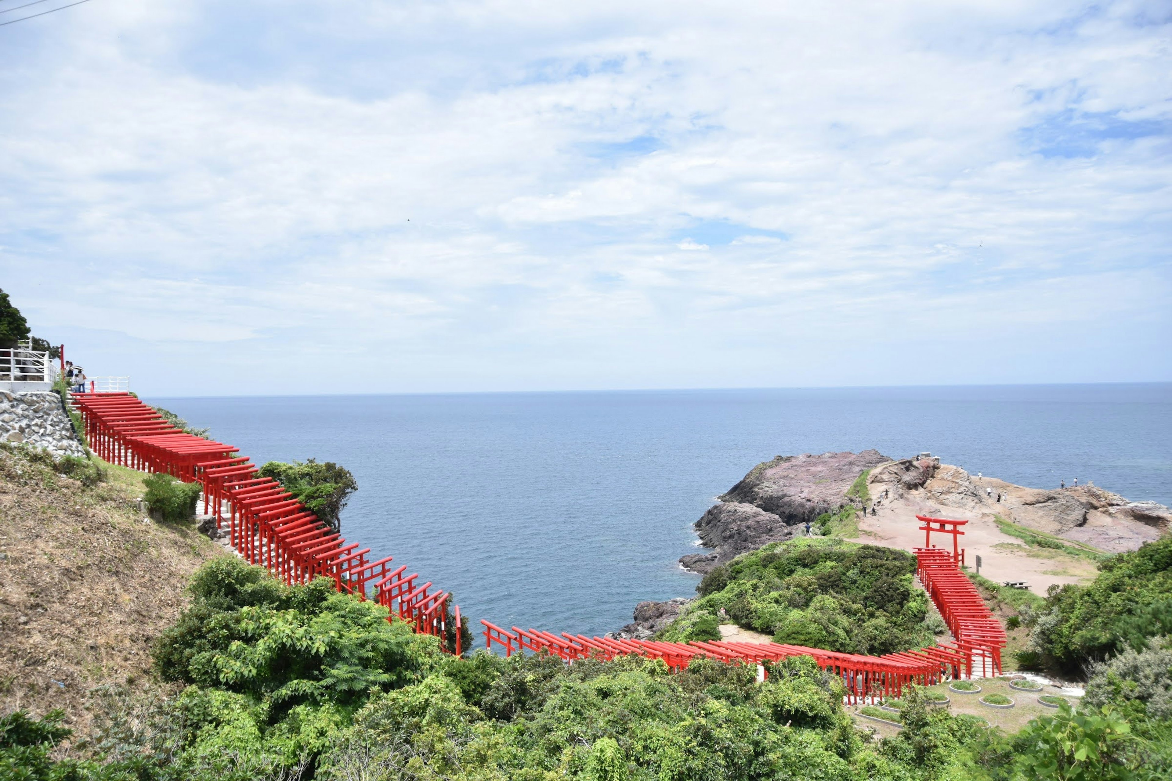 Scenic view of red bridges leading to the ocean