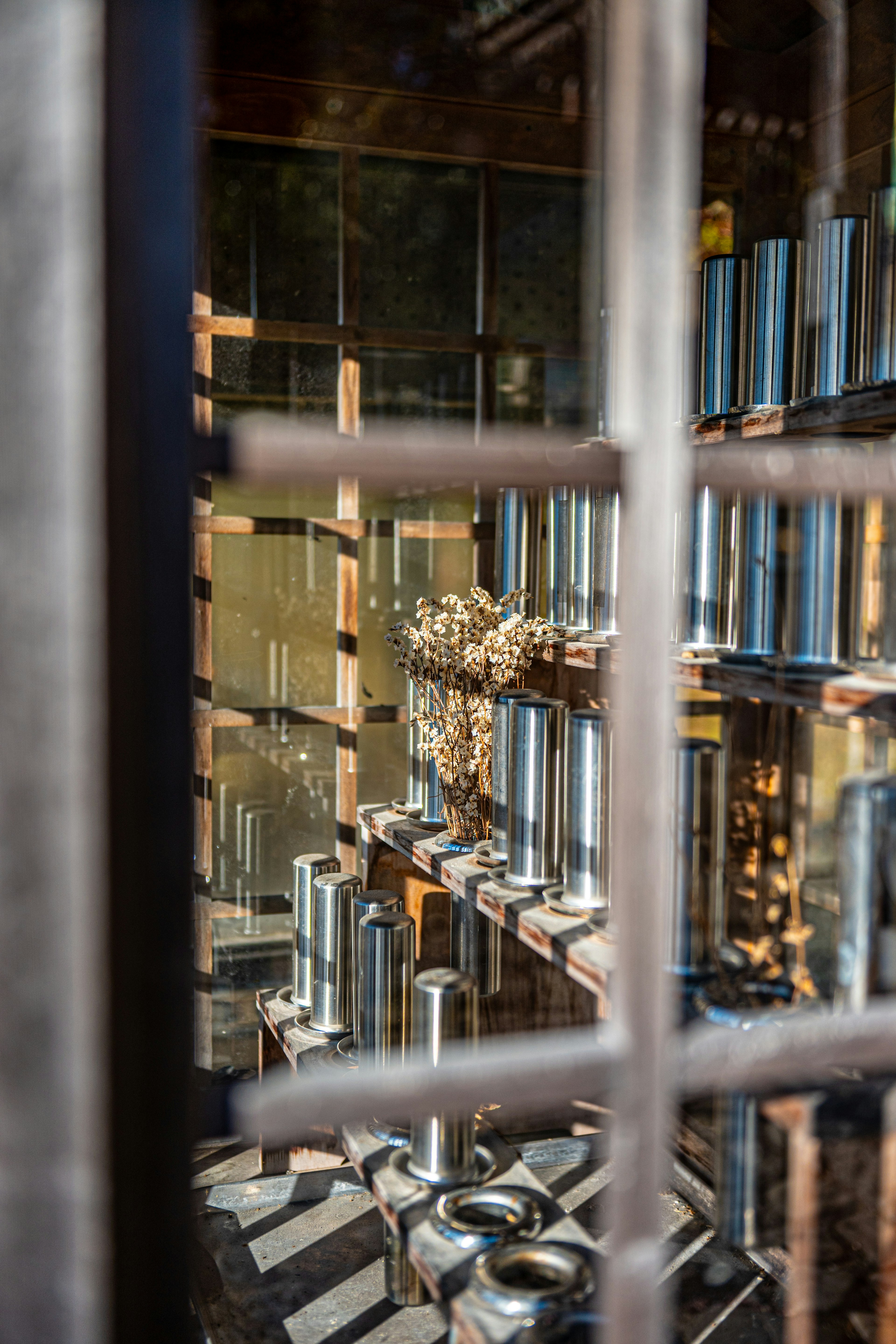 Interior view showcasing metal pipes and glass structure