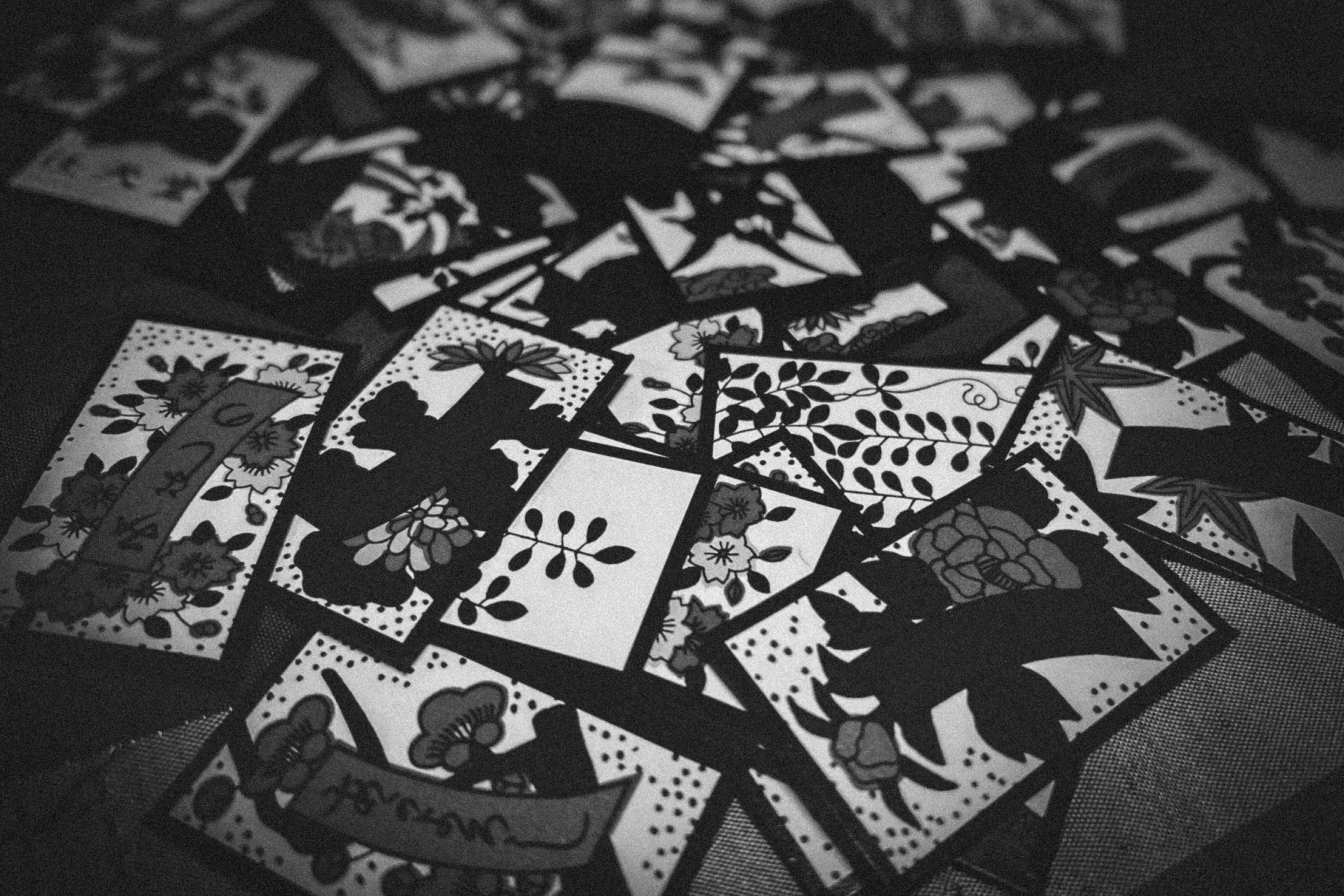 Image of scattered black and white art cards