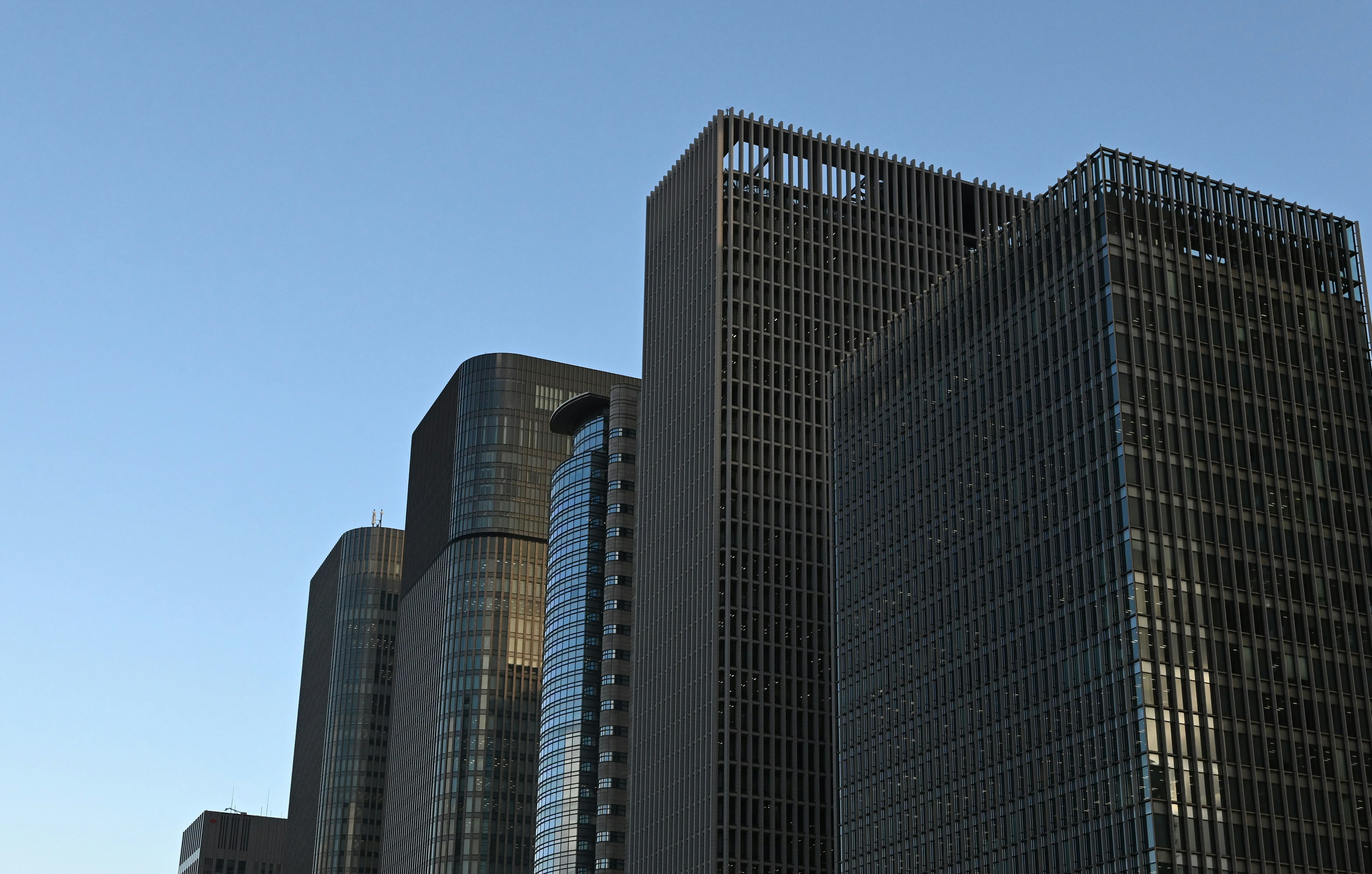 Modern skyscrapers against a clear blue sky