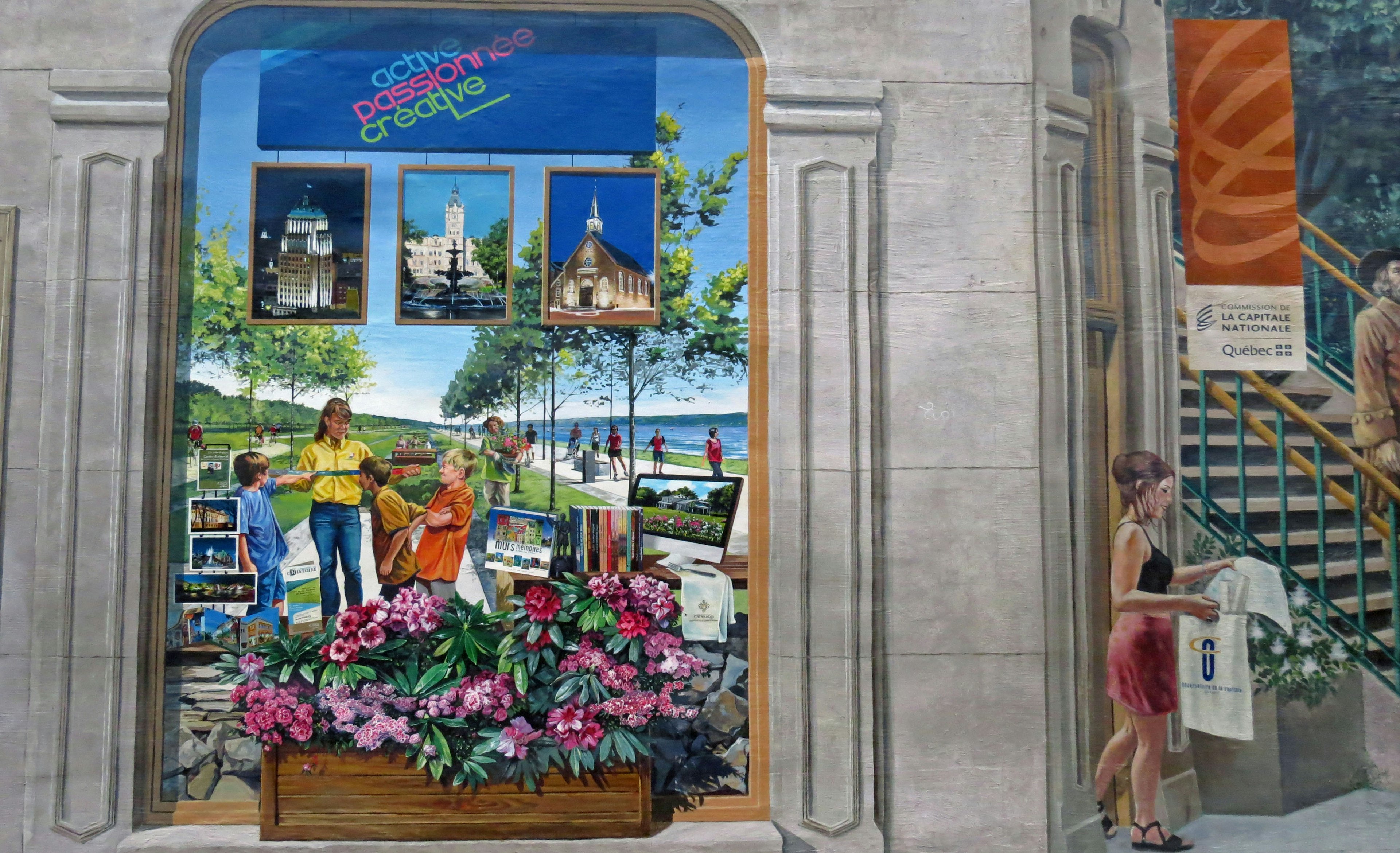 A storefront featuring colorful flowers and scenic tourist photos