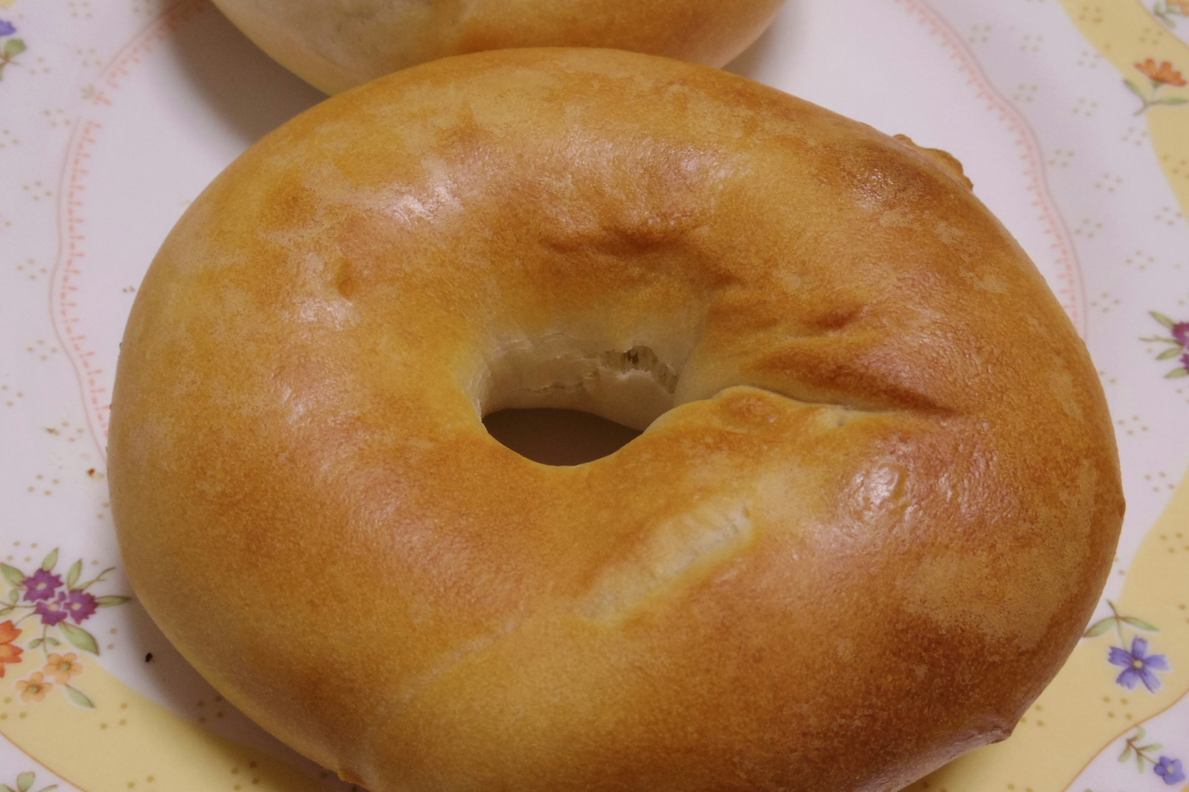 Freshly baked bagels on a decorative plate