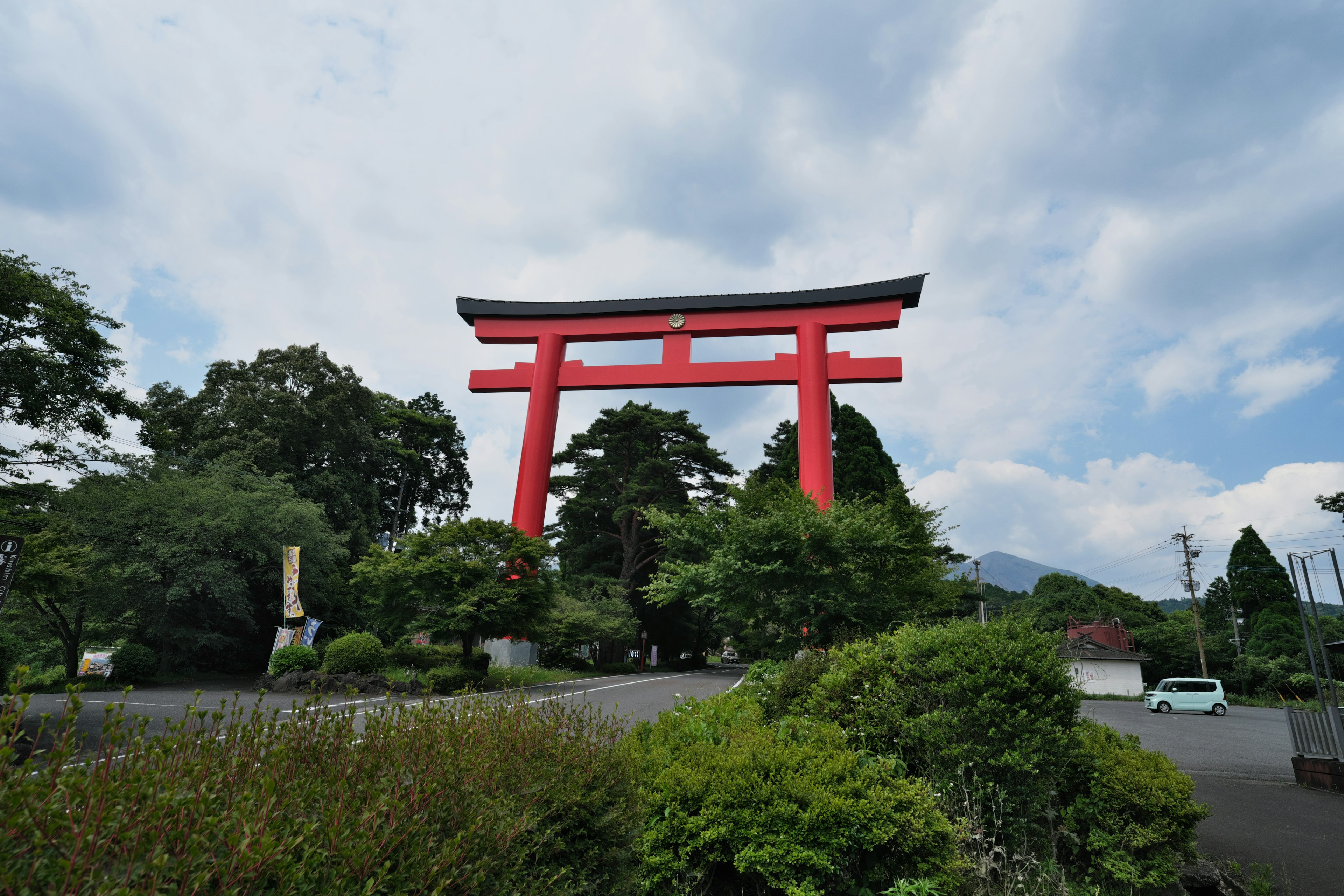 Red torii gate surrounded by lush greenery