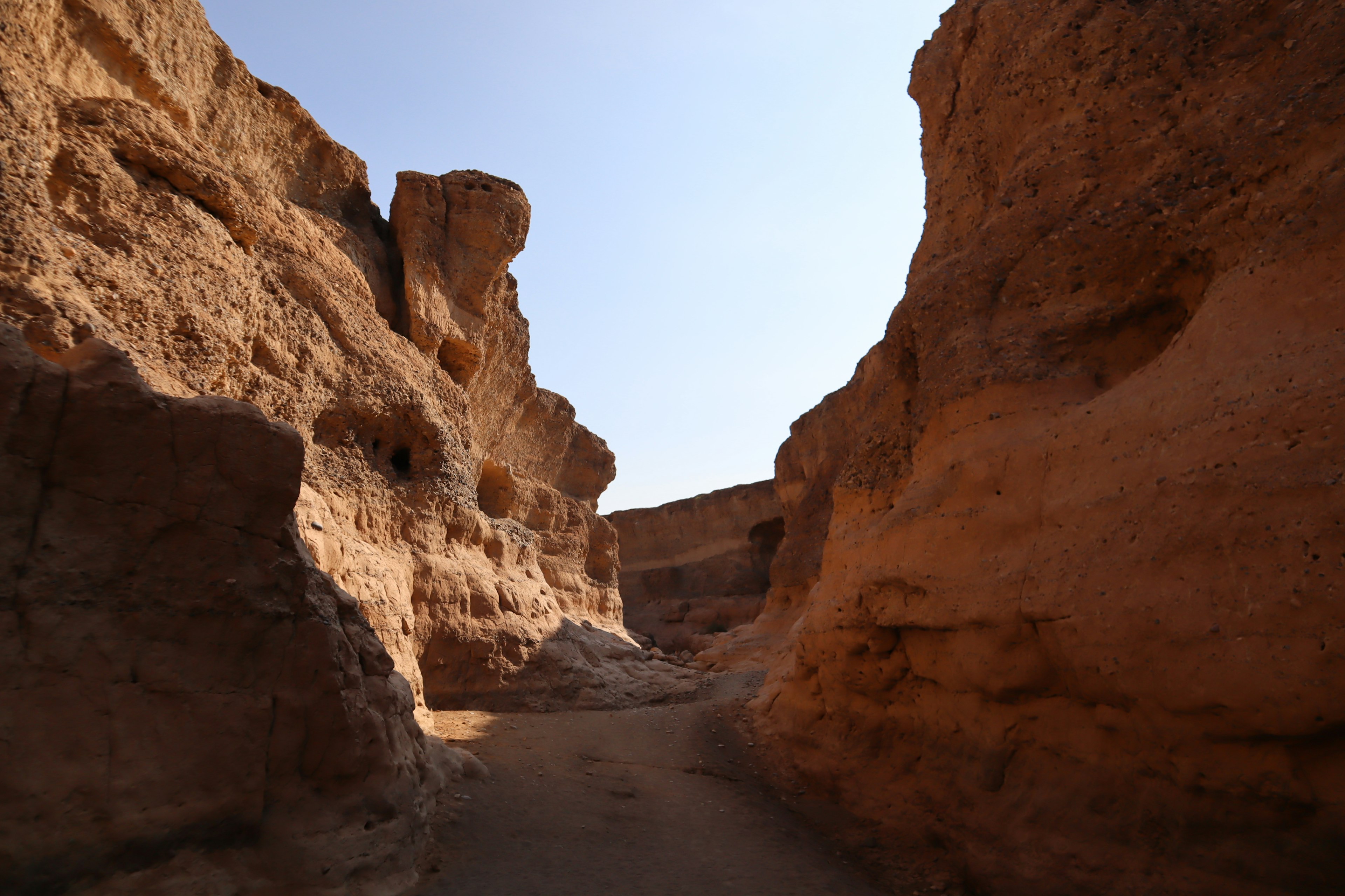 A large rocky canyon with a clear blue sky