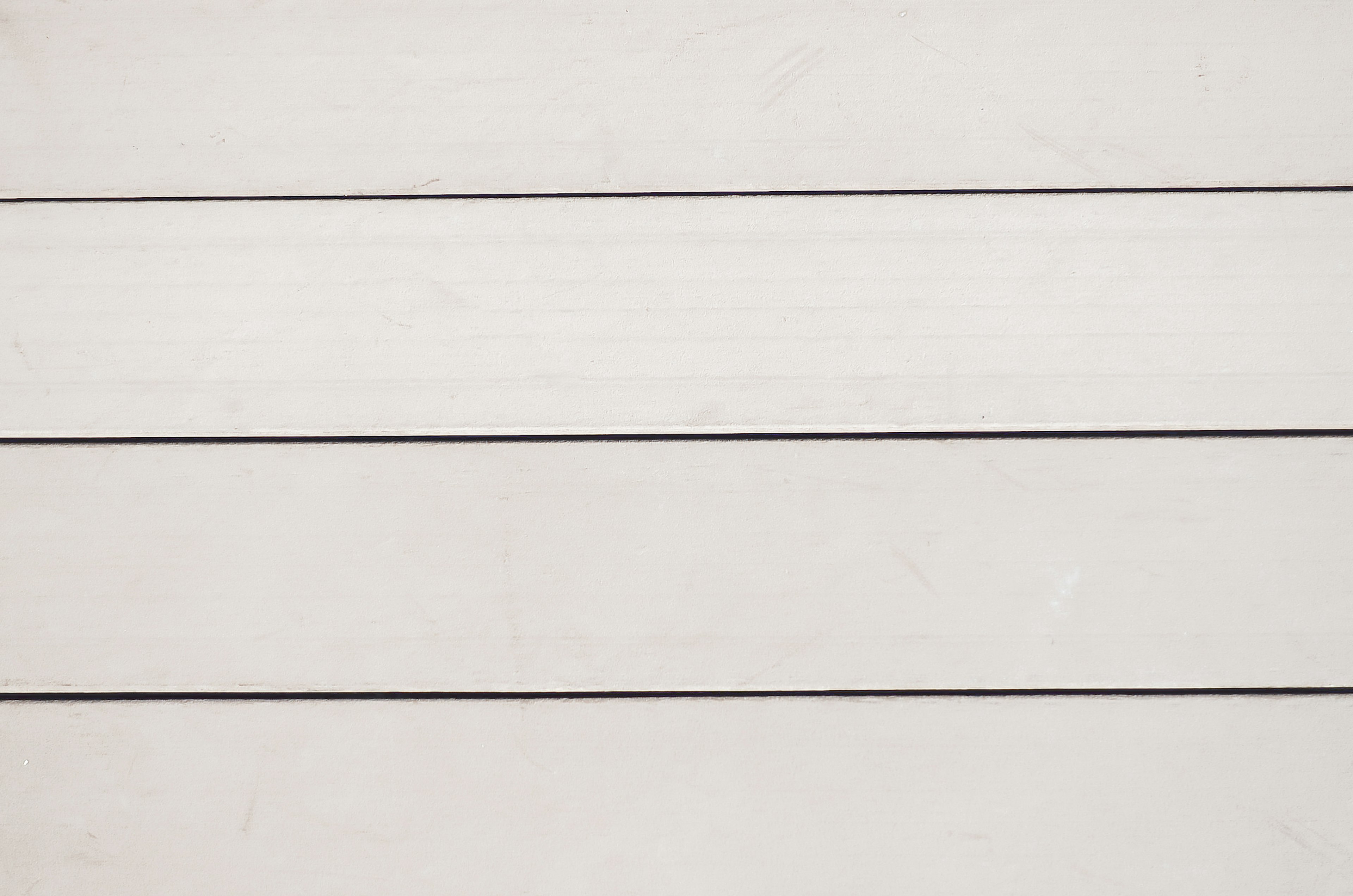 Texture of white wooden planks arranged in a horizontal pattern