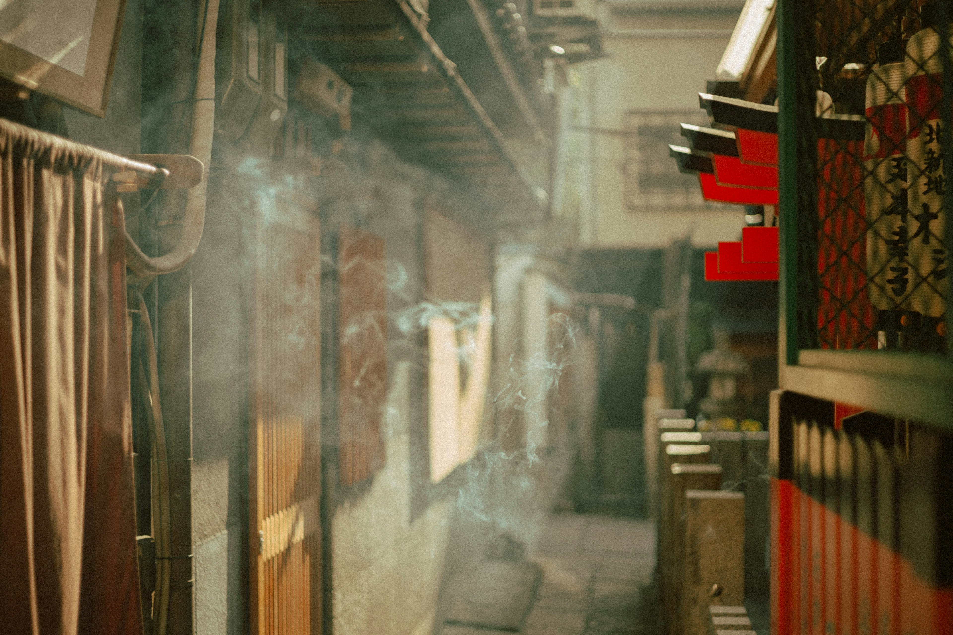 Narrow alleyway with drifting smoke