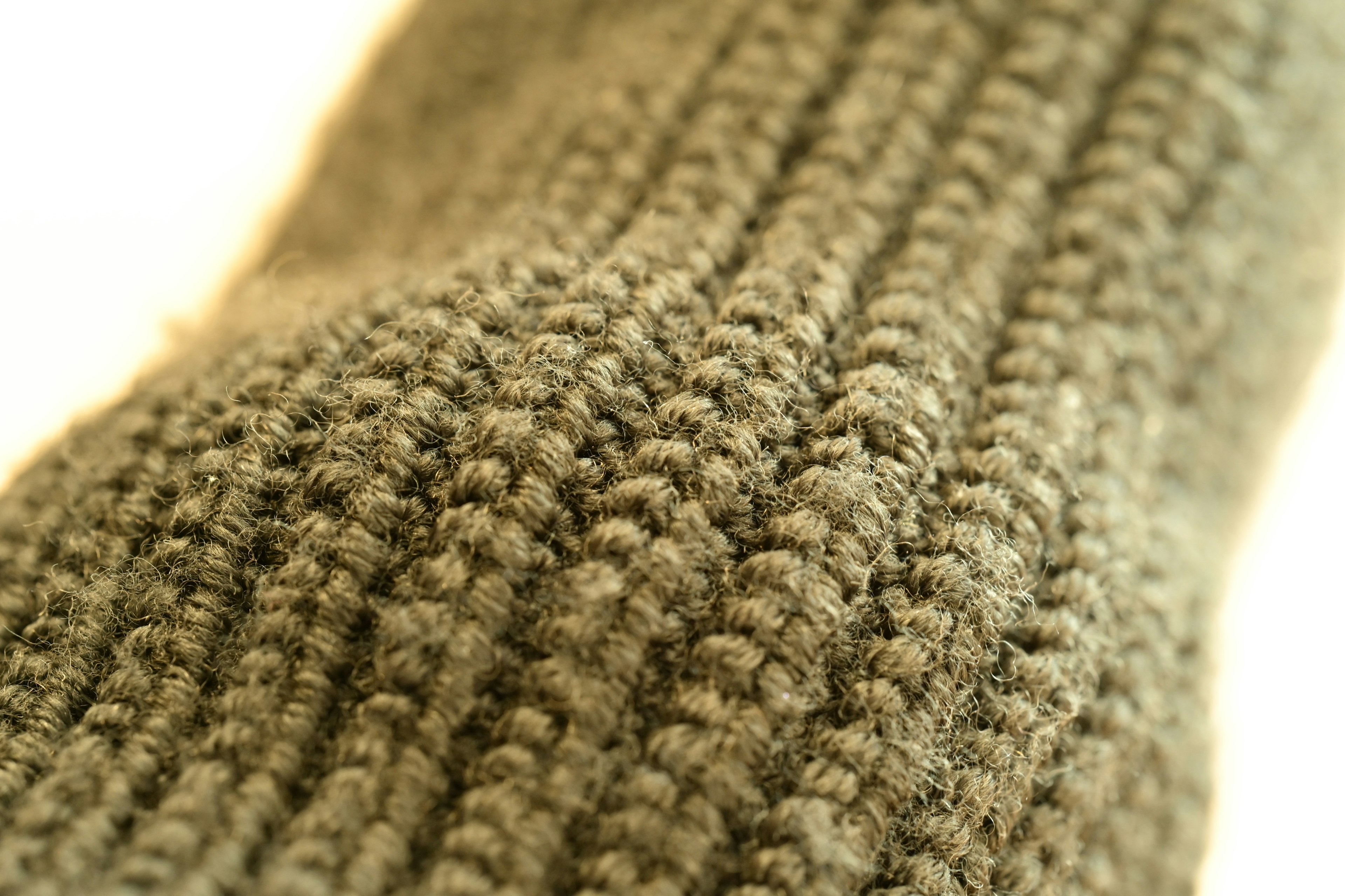 Close-up image of a green knitted sock