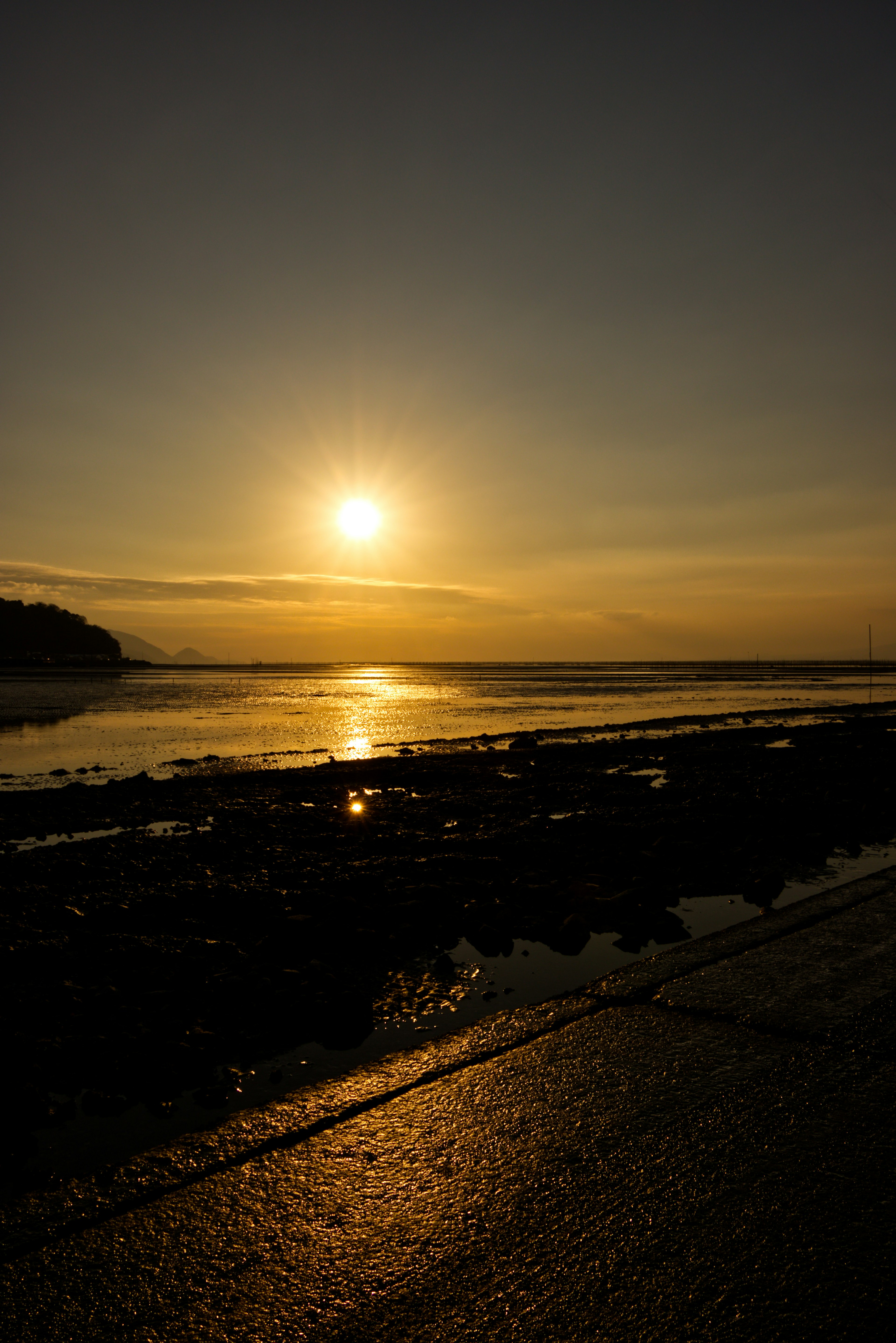 Beautiful landscape with sunset reflecting on the ocean