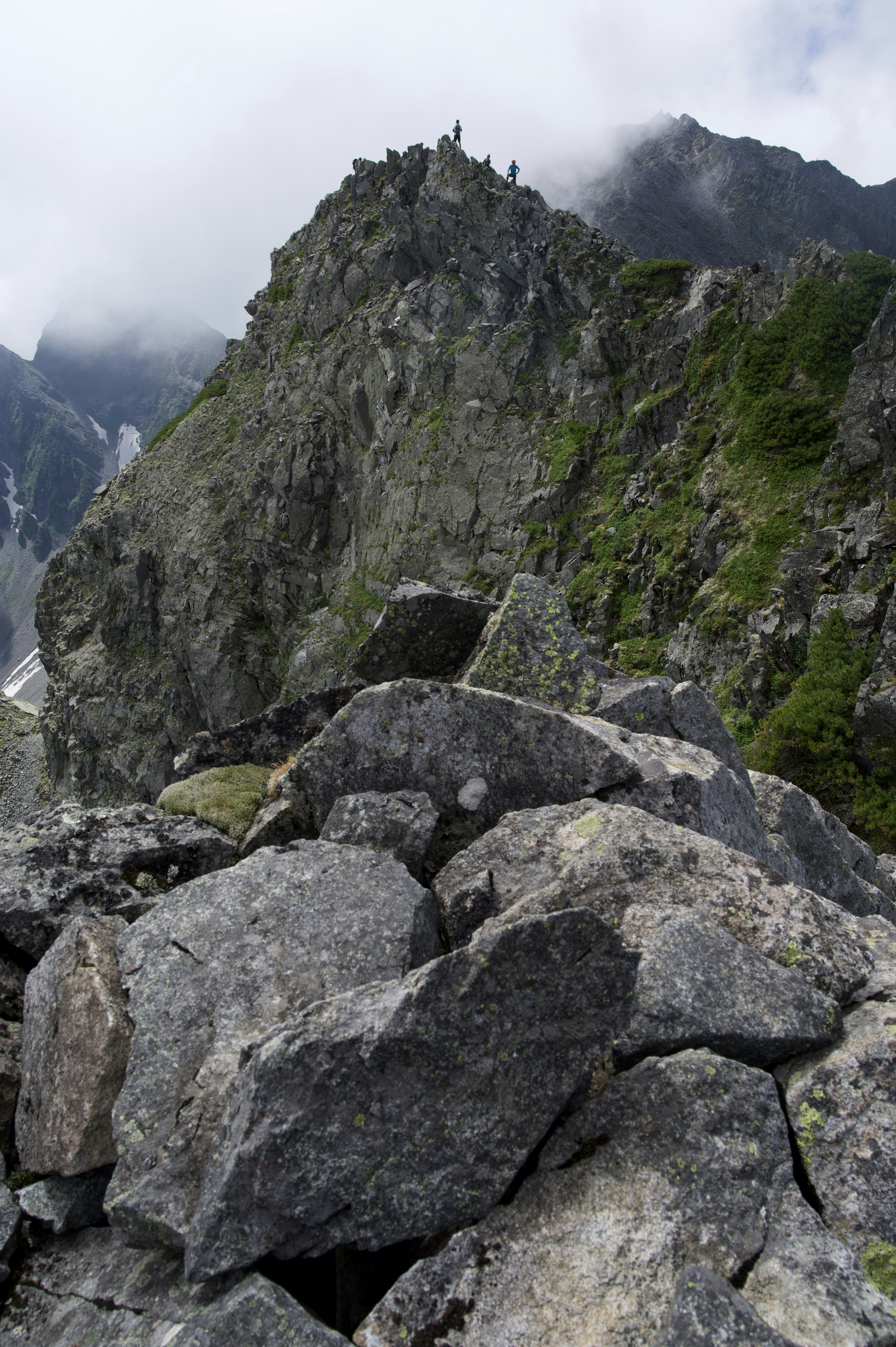 Rocky mountain landscape with a peak shrouded in clouds