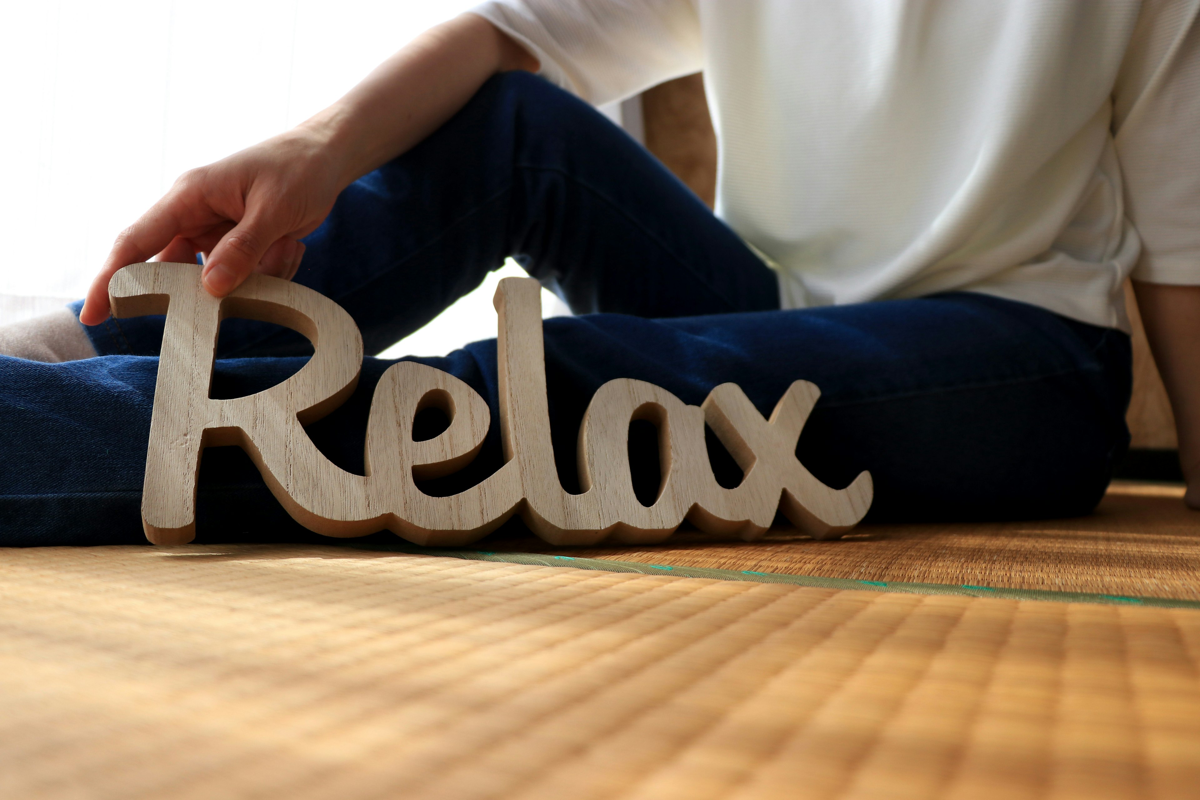 Image featuring a decorative wooden sign that says Relax