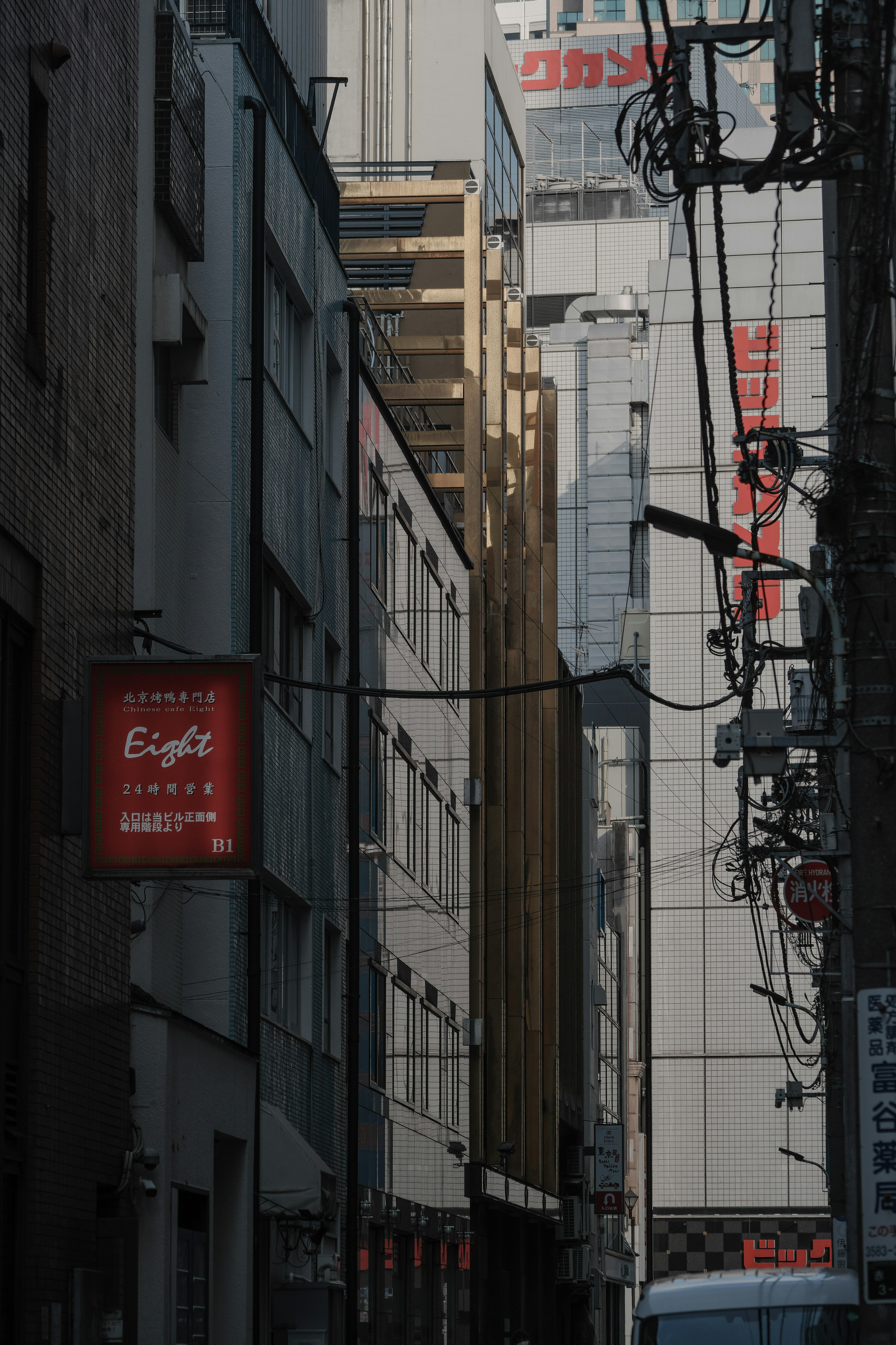 Narrow alley with buildings and utility poles