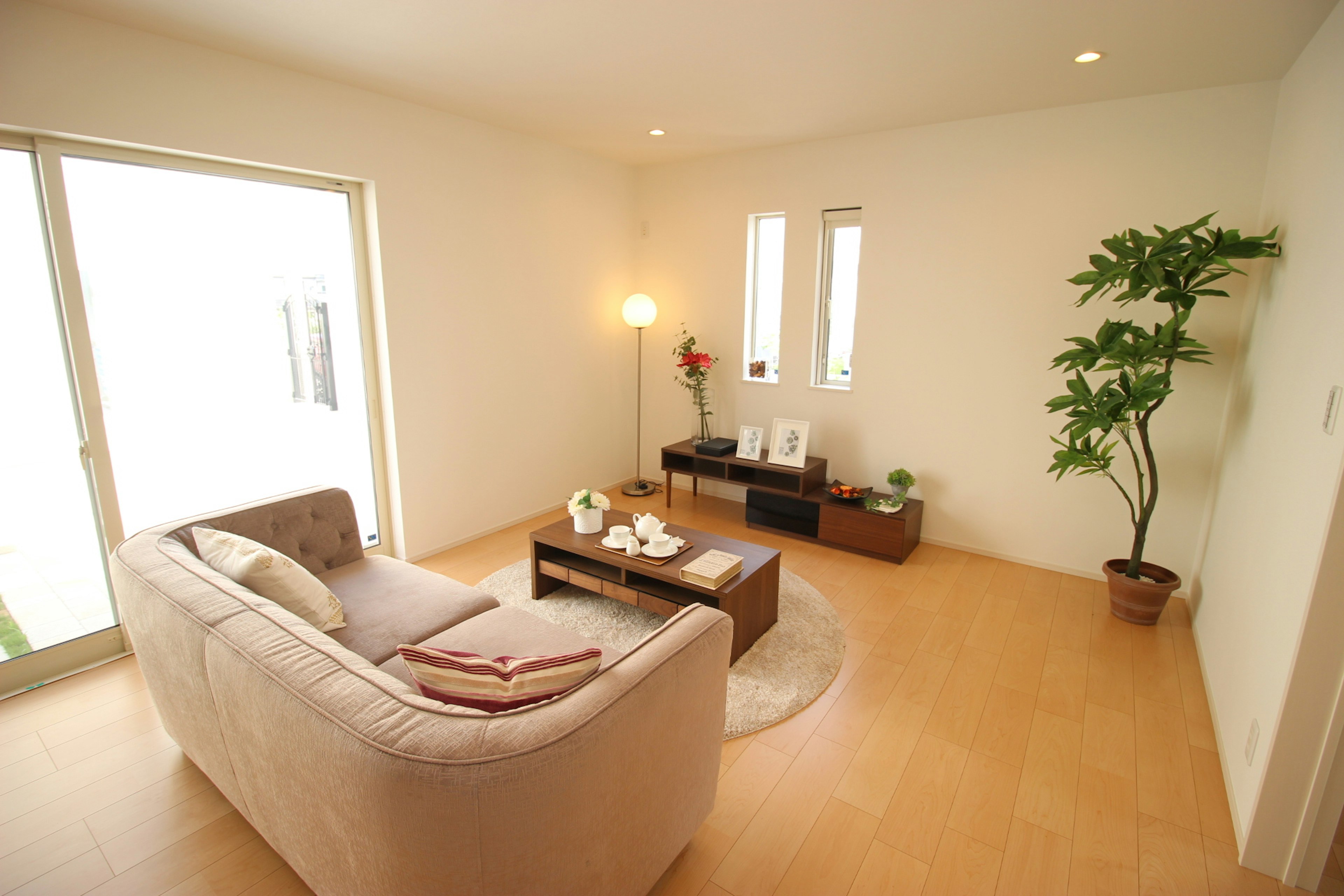 Bright living room featuring a sofa and coffee table