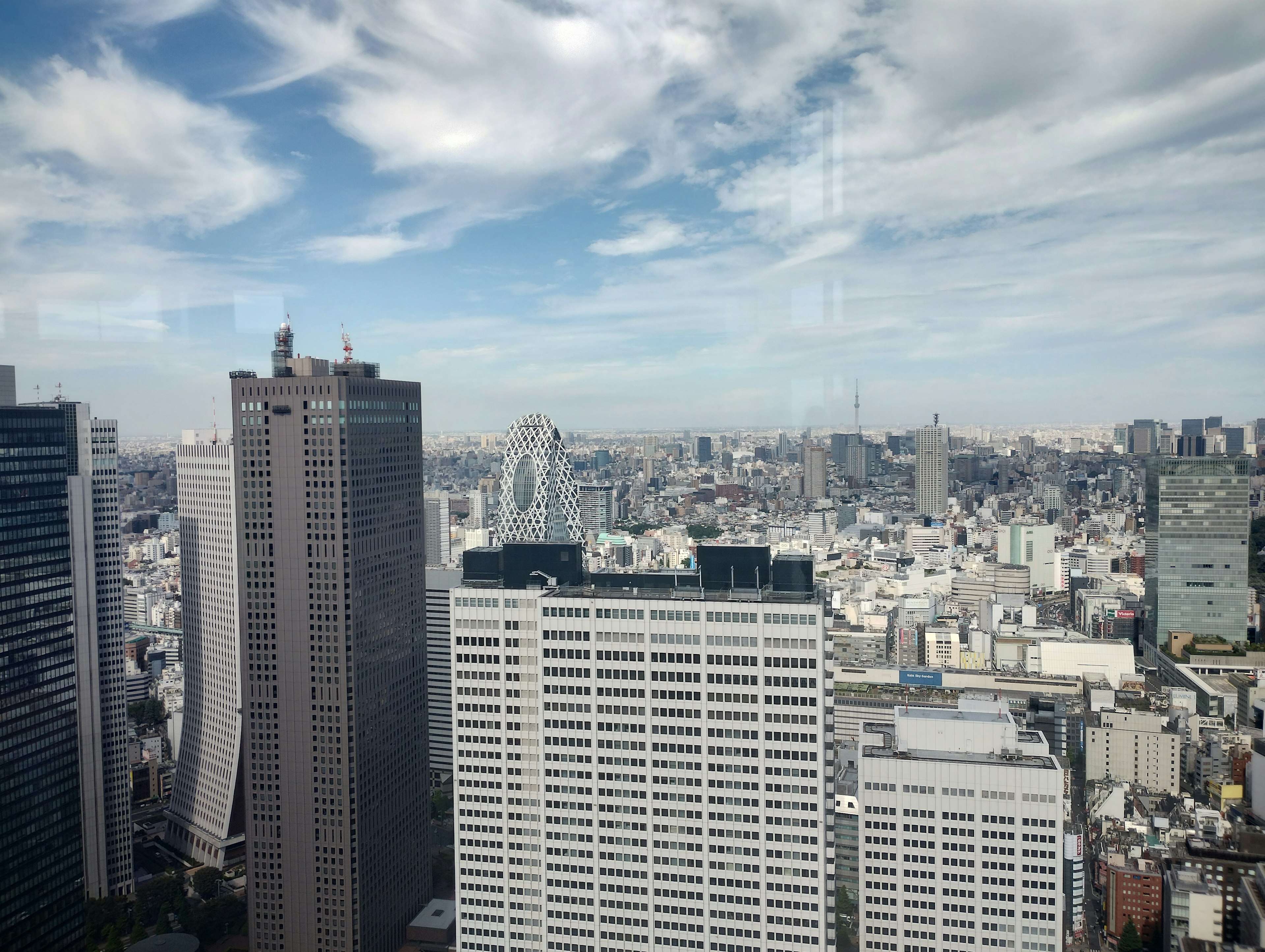 View of Tokyo skyscrapers under a blue sky