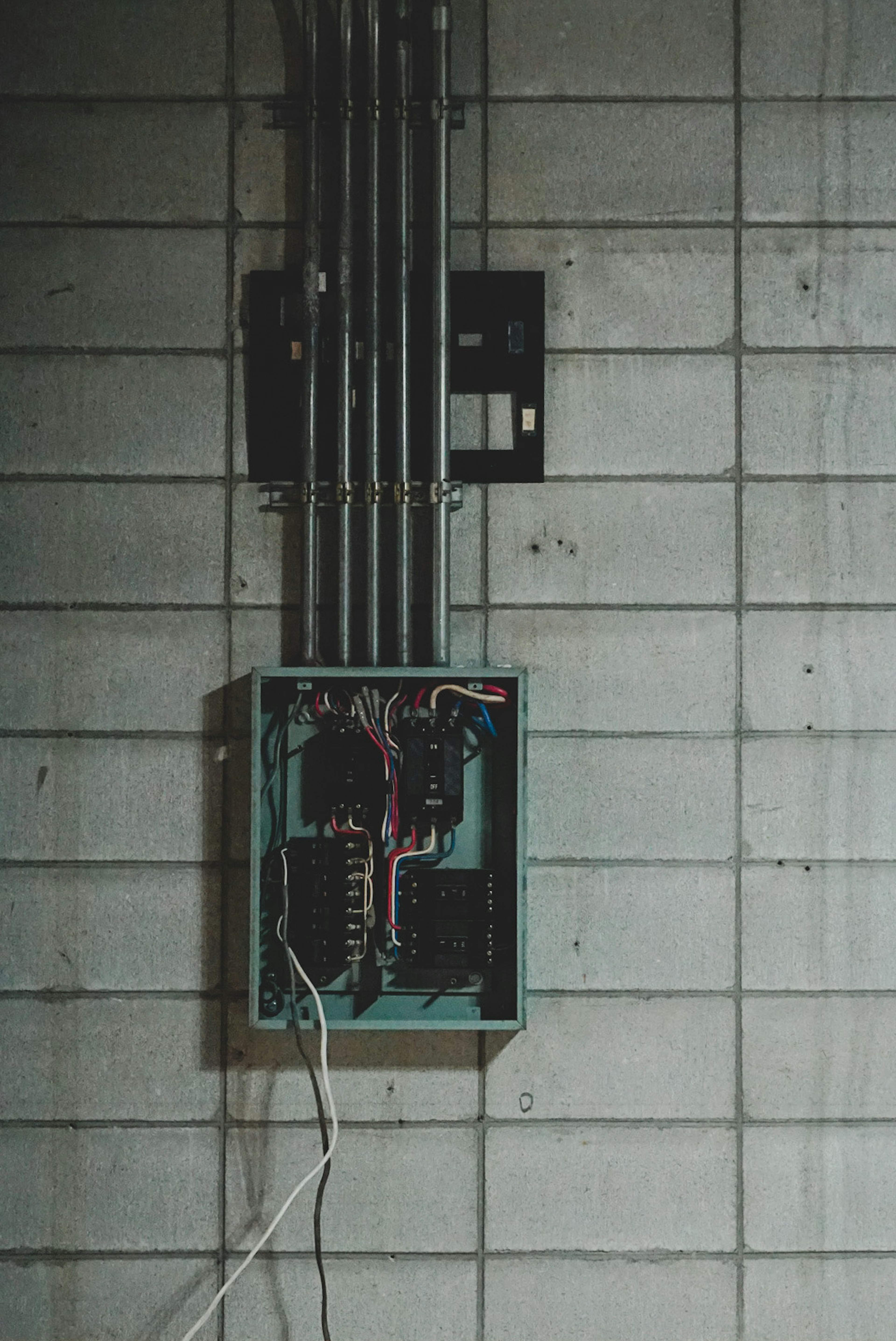 Image of electrical wiring and distribution box mounted on a wall