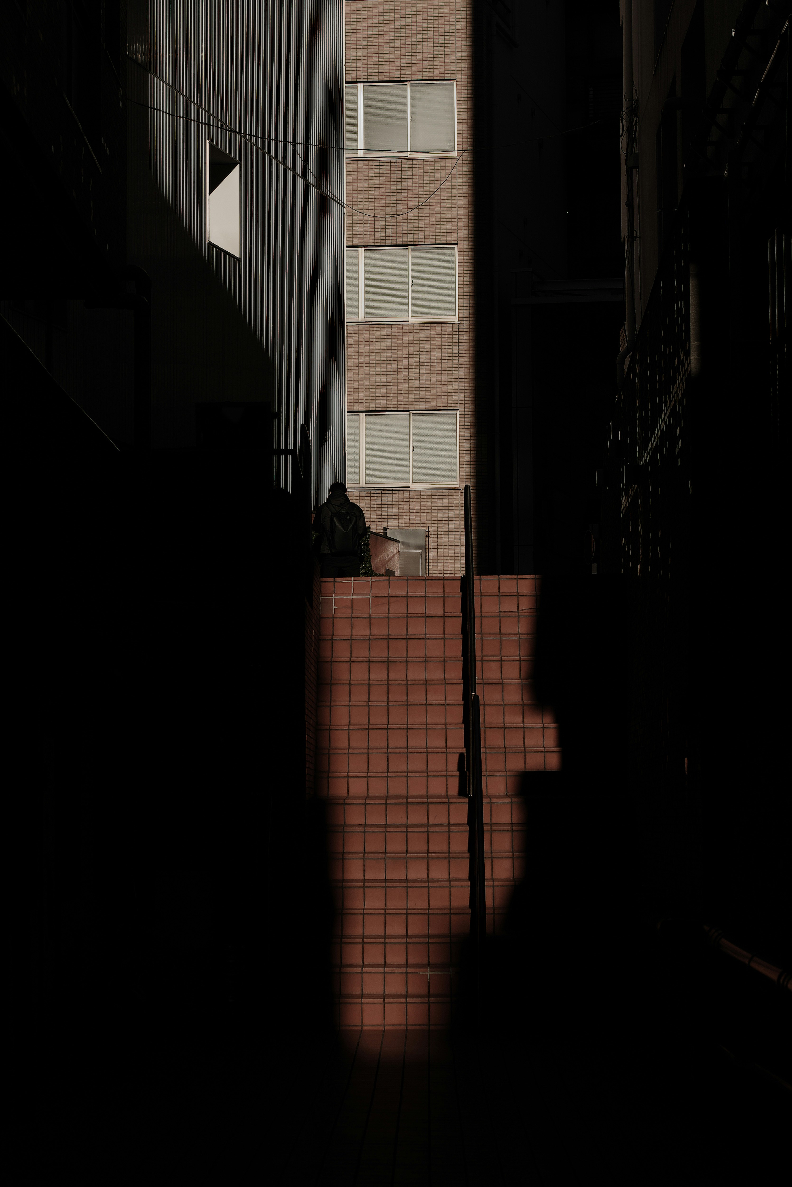 Shadows of walls and buildings in a dark alley