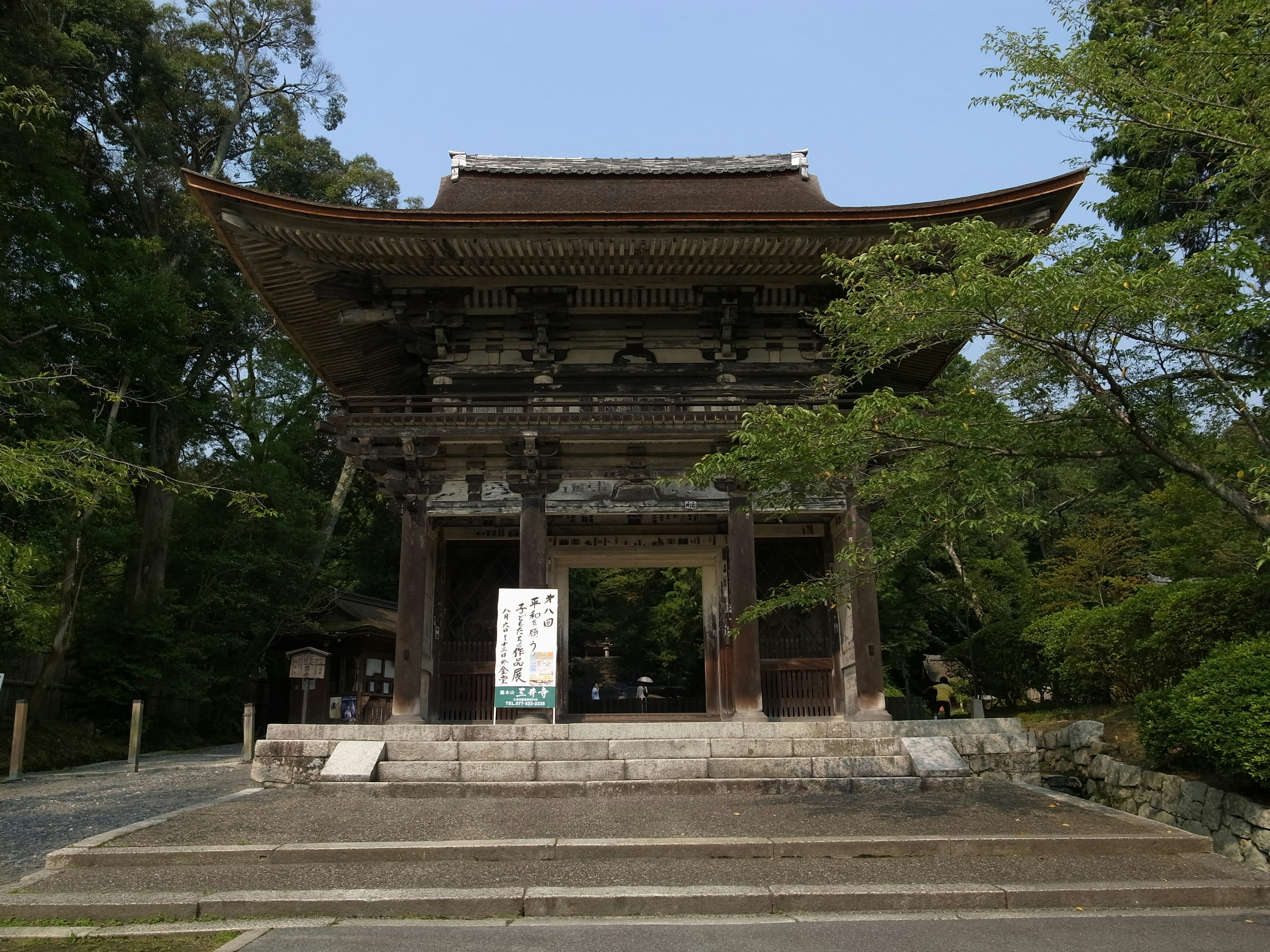 Ancient temple gate surrounded by greenery