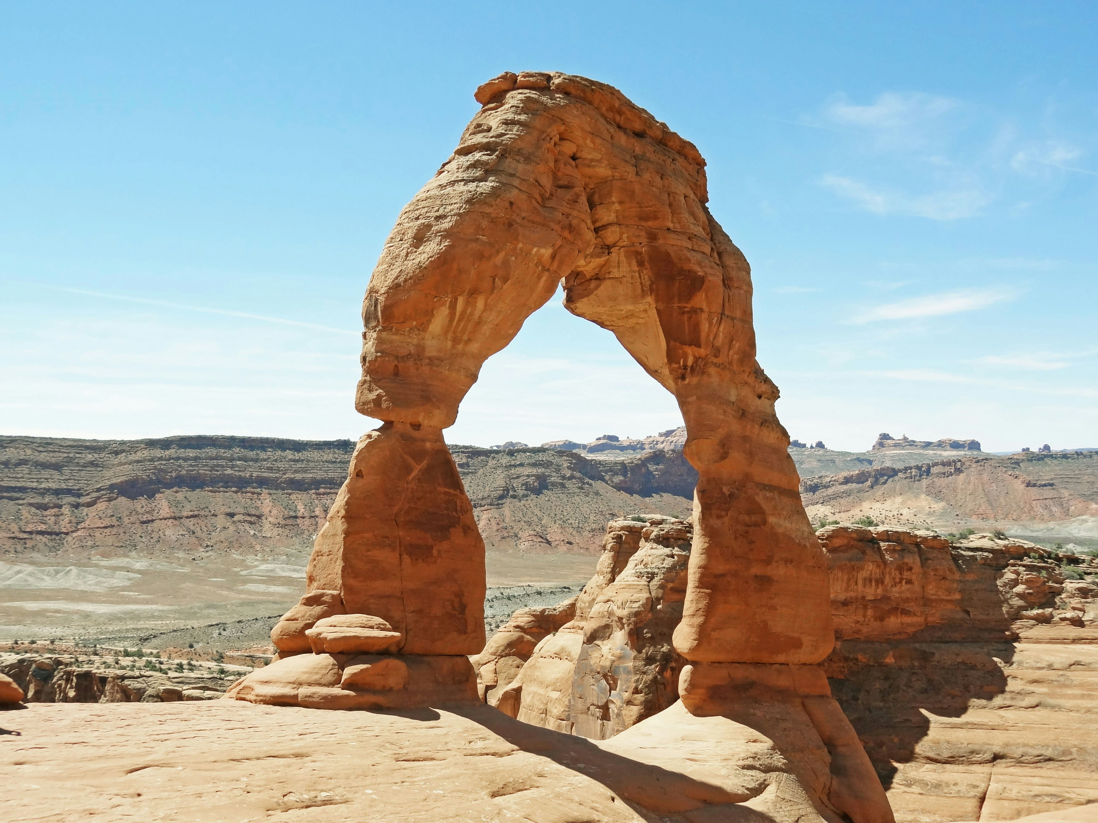 Natural stone arch formation in a vast landscape