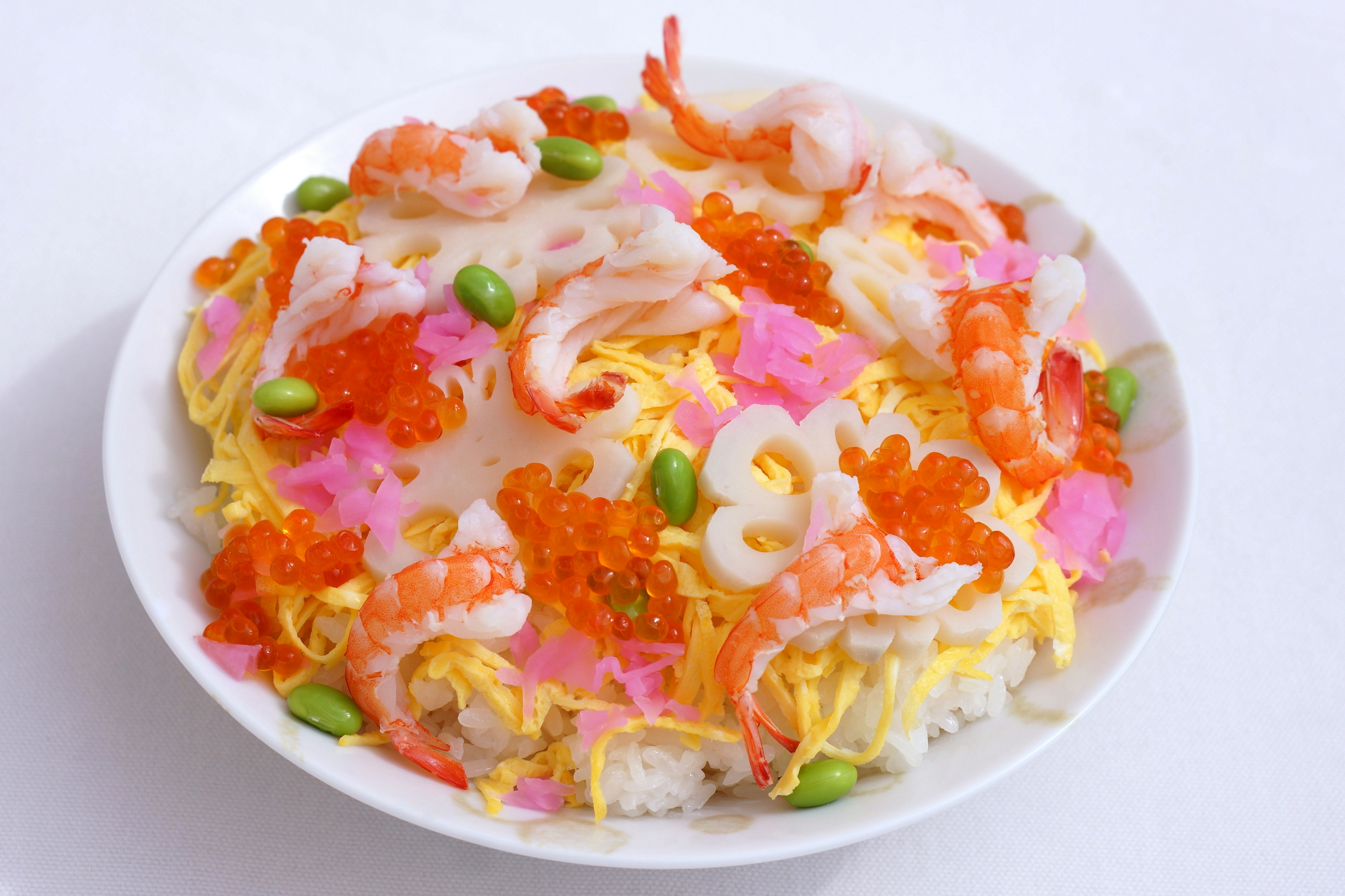 A vibrant seafood and vegetable dish beautifully arranged on a plate