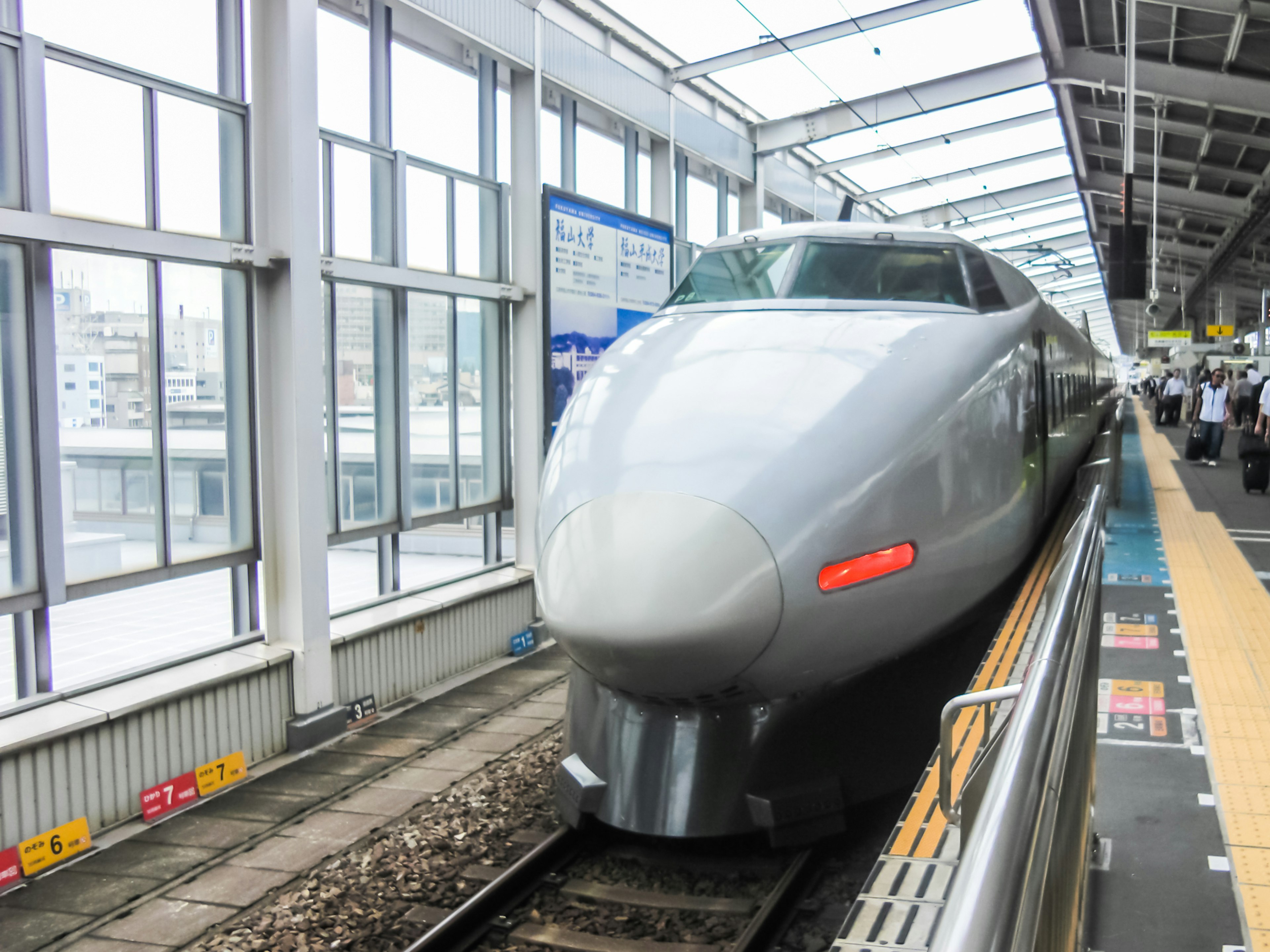 Shinkansen train at a modern station