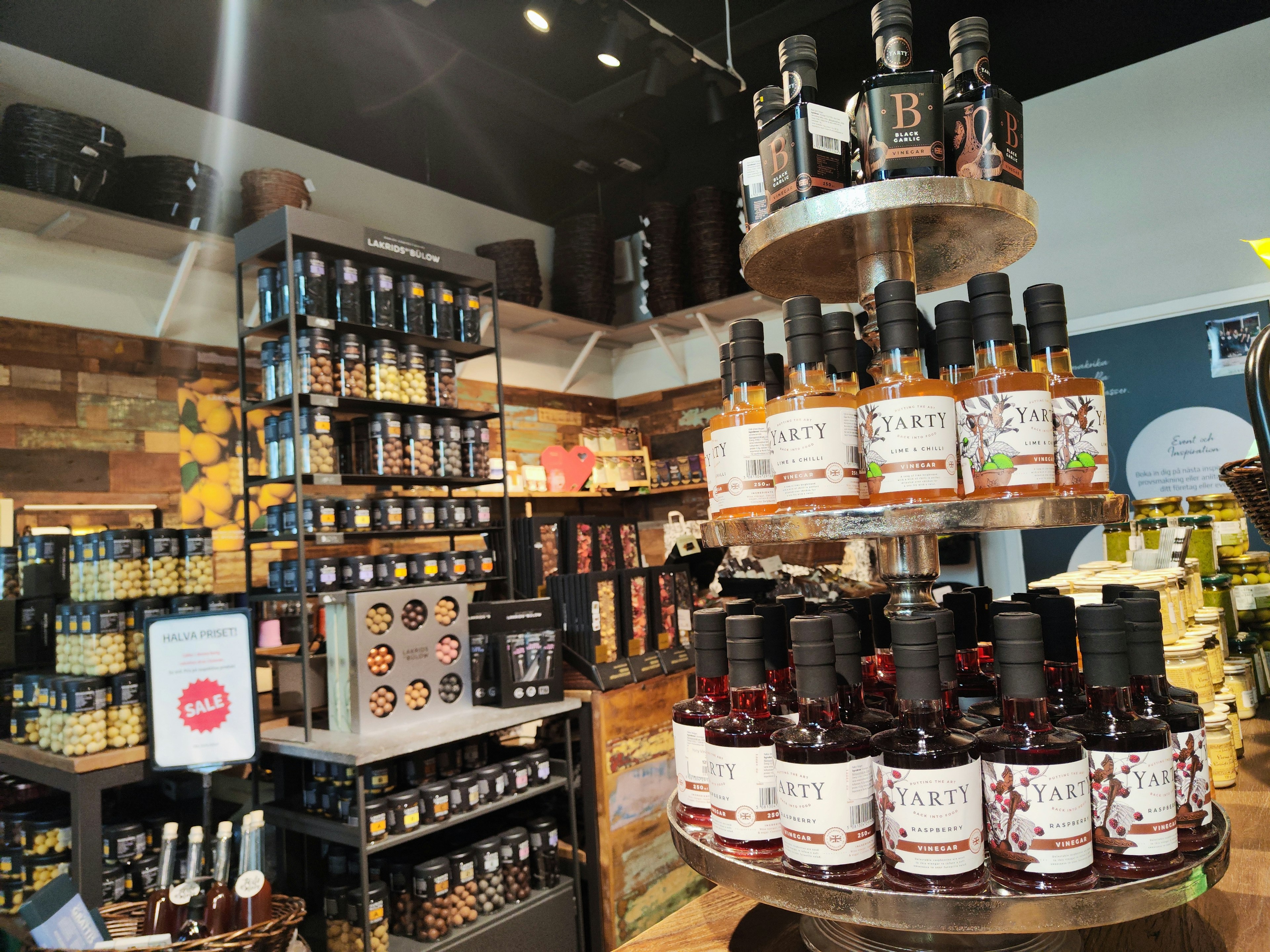 Shelves filled with various bottles and their labels in a store