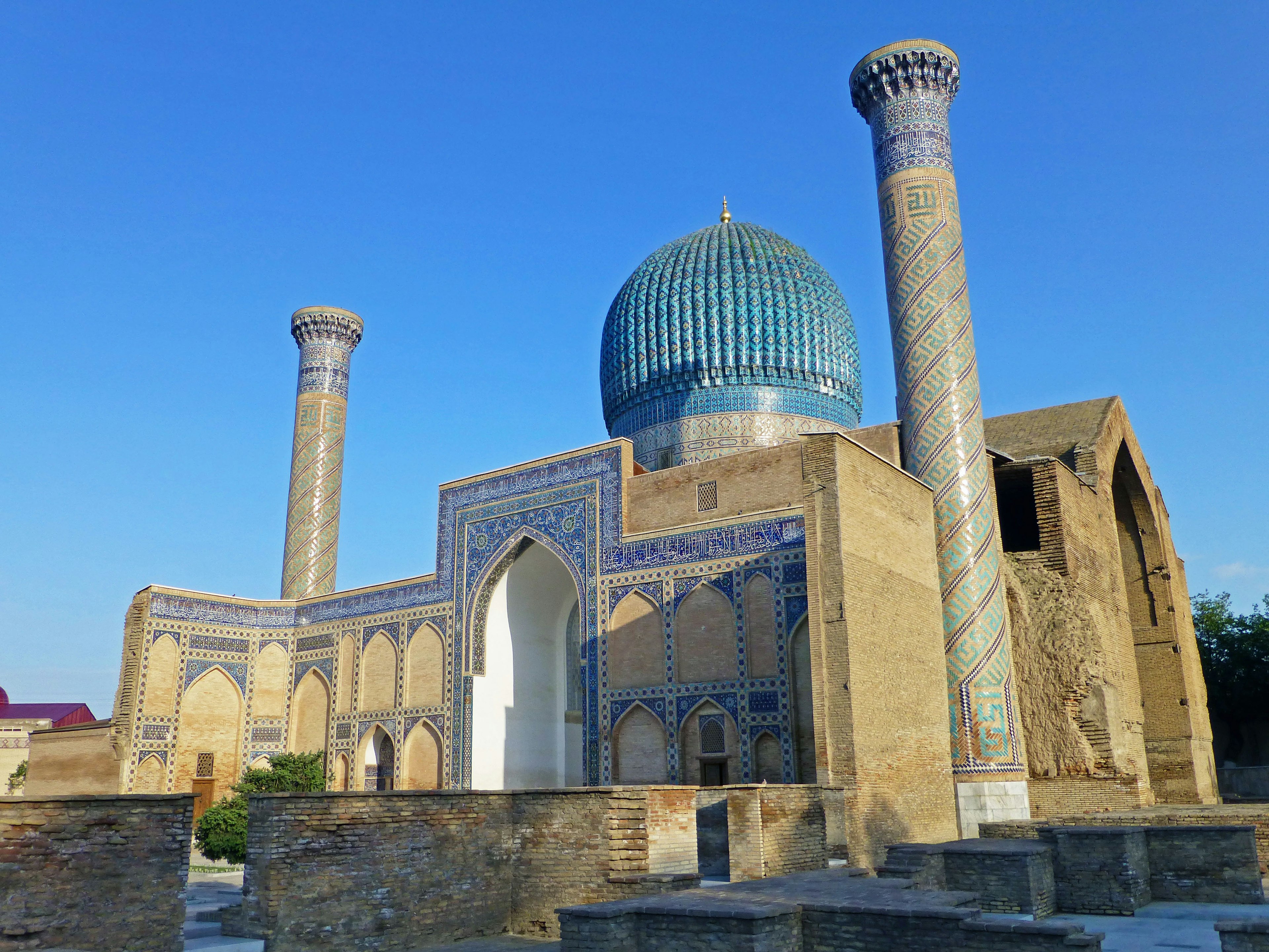 Ancient architectural structure with a blue dome and ornate walls