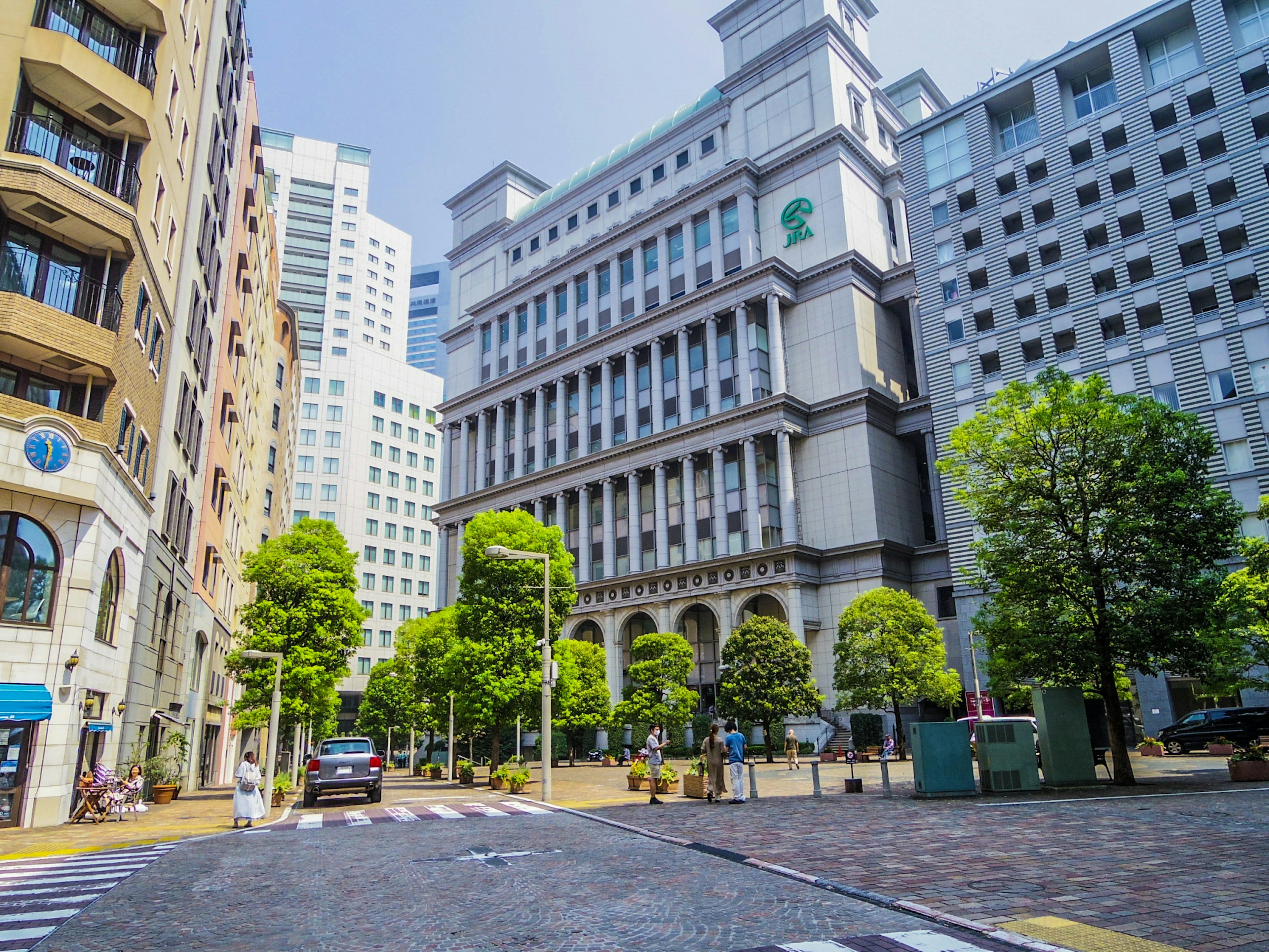 Urban landscape with tall buildings and green trees