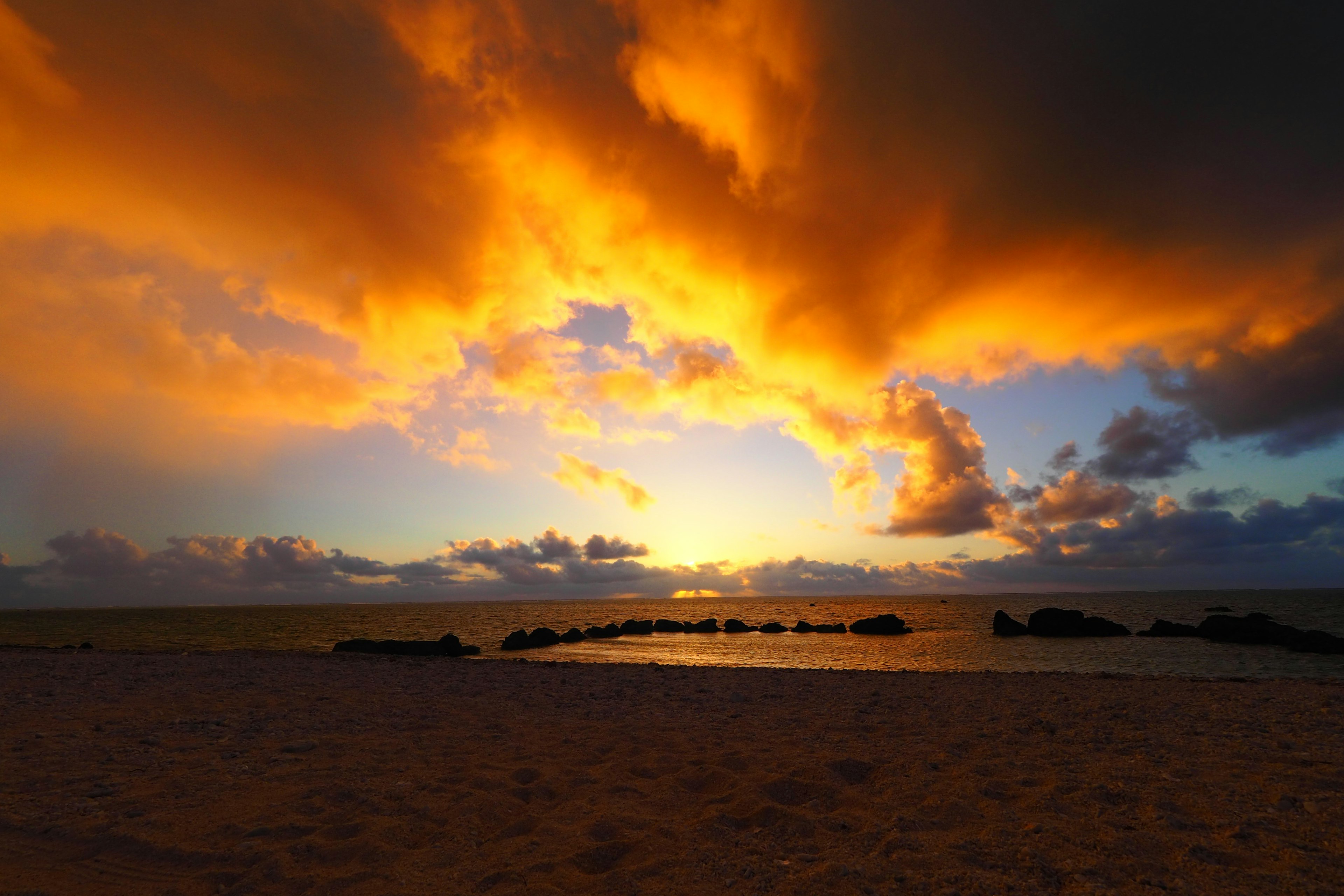 Stunning sunset with vibrant clouds over the ocean