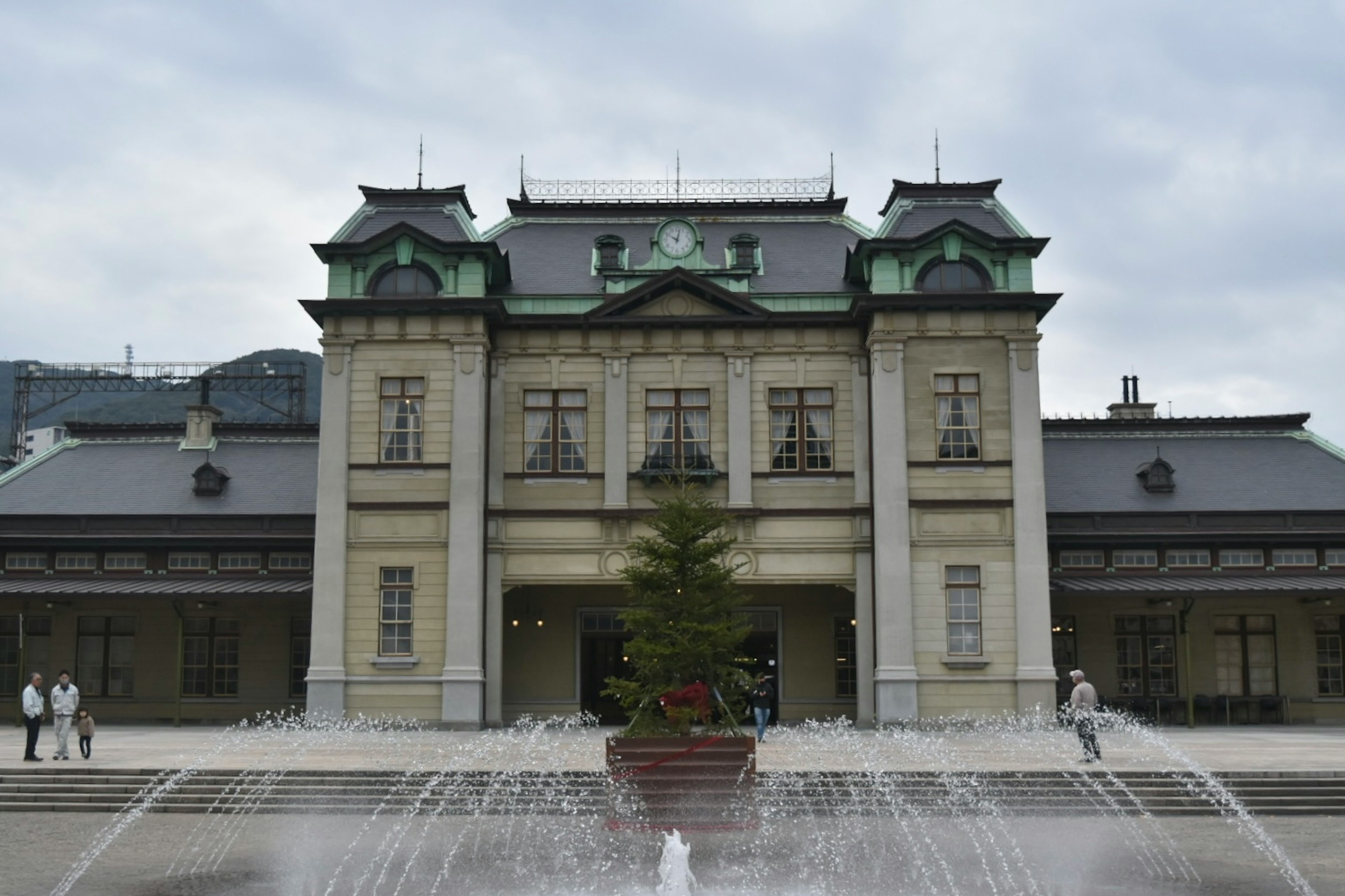 Historic building with a fountain in the foreground