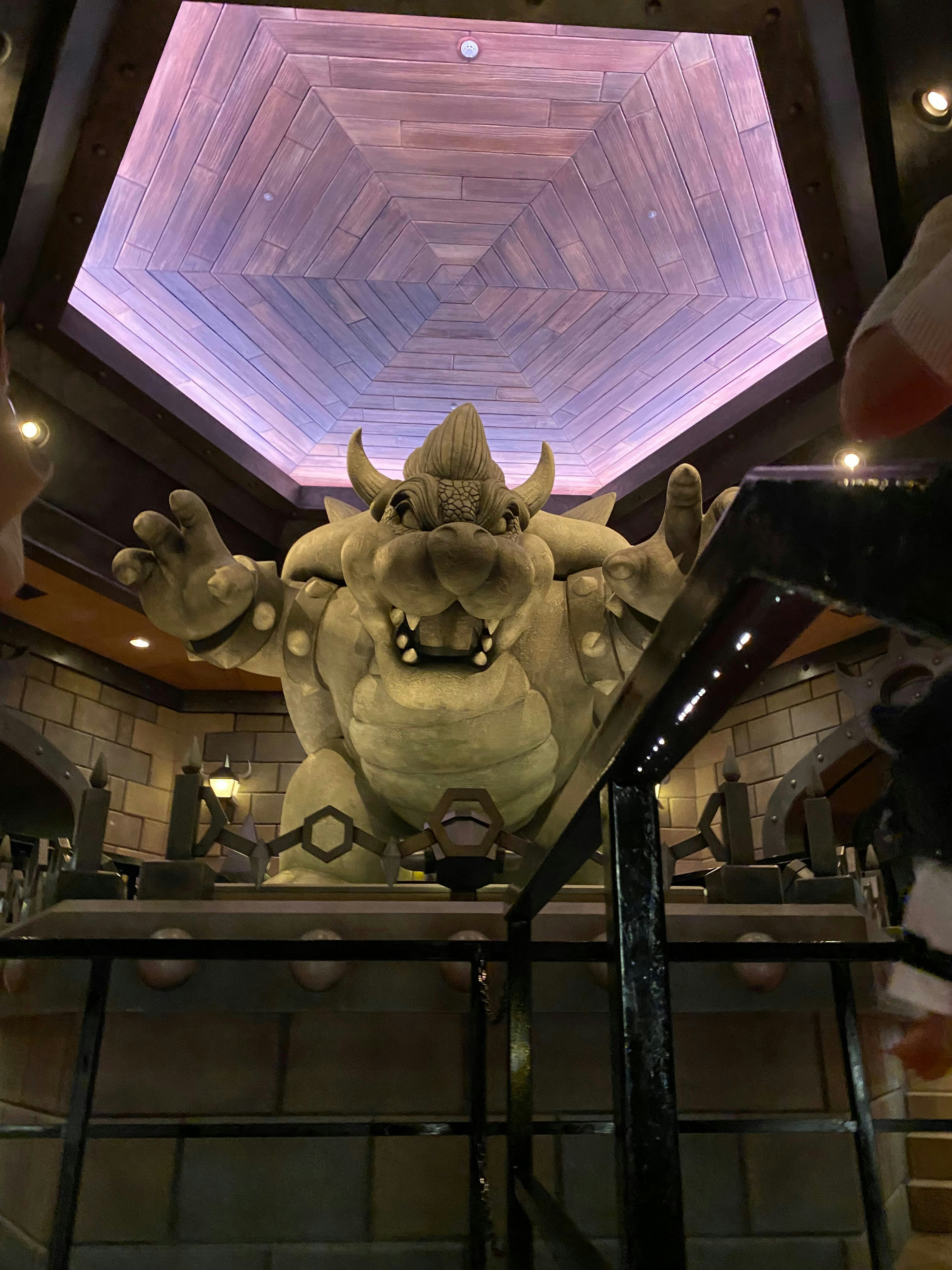 An imposing monster sculpture in a themed interior room